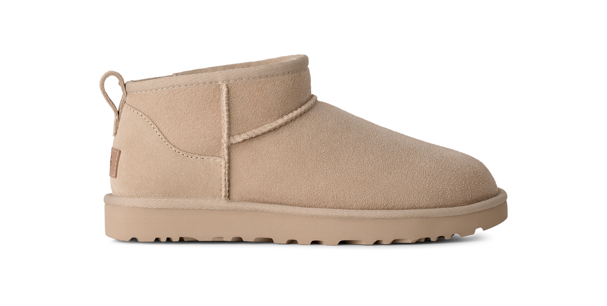 A single beige suede ankle boot shown in profile against a plain white background.