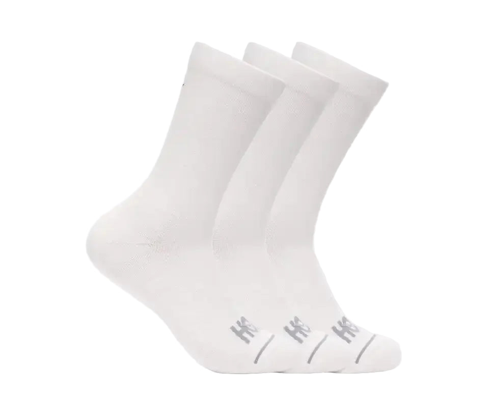 Two white socks with a subtle pattern on a light gray background