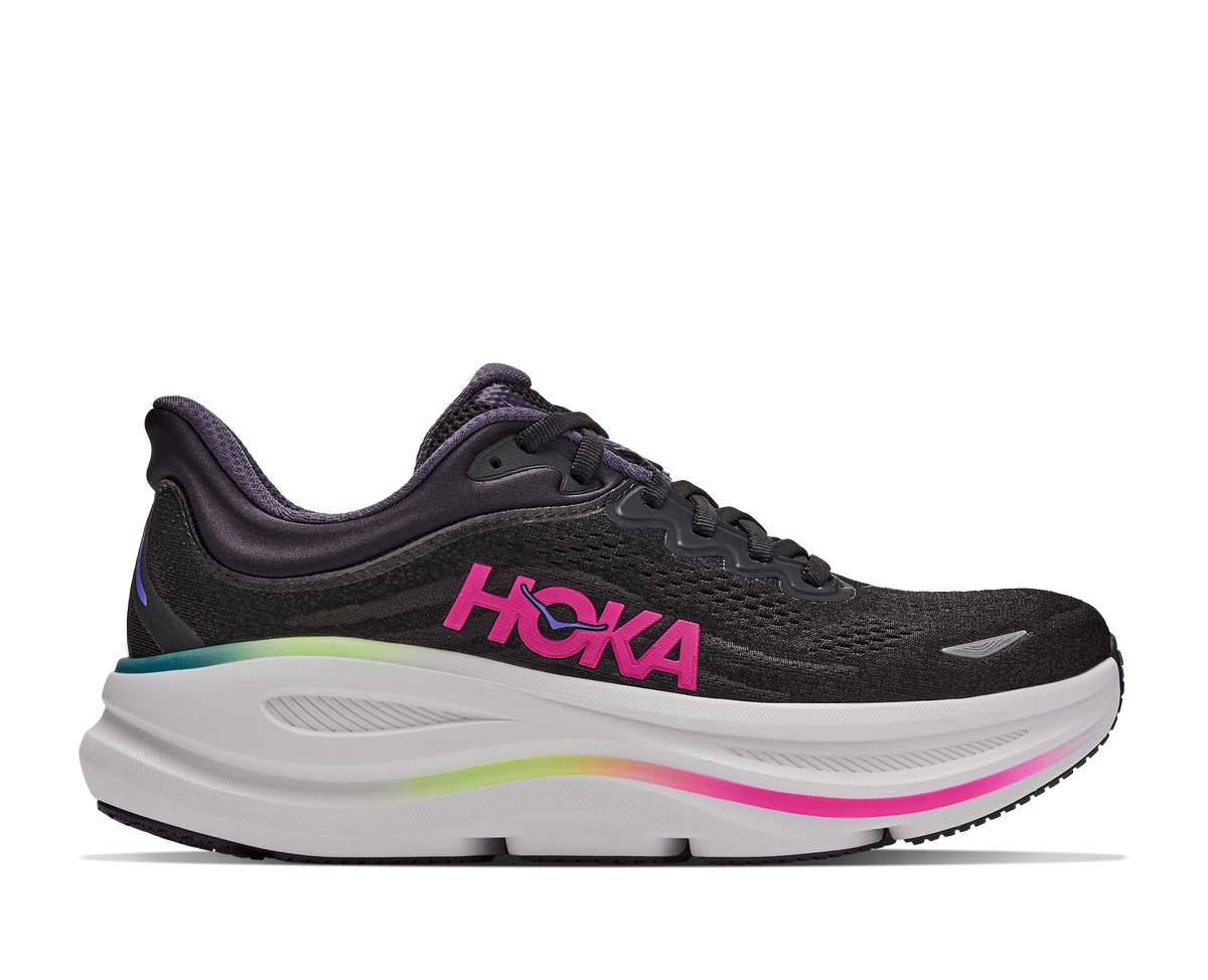 Black running shoe with pink 'Hoka' logo on a white background