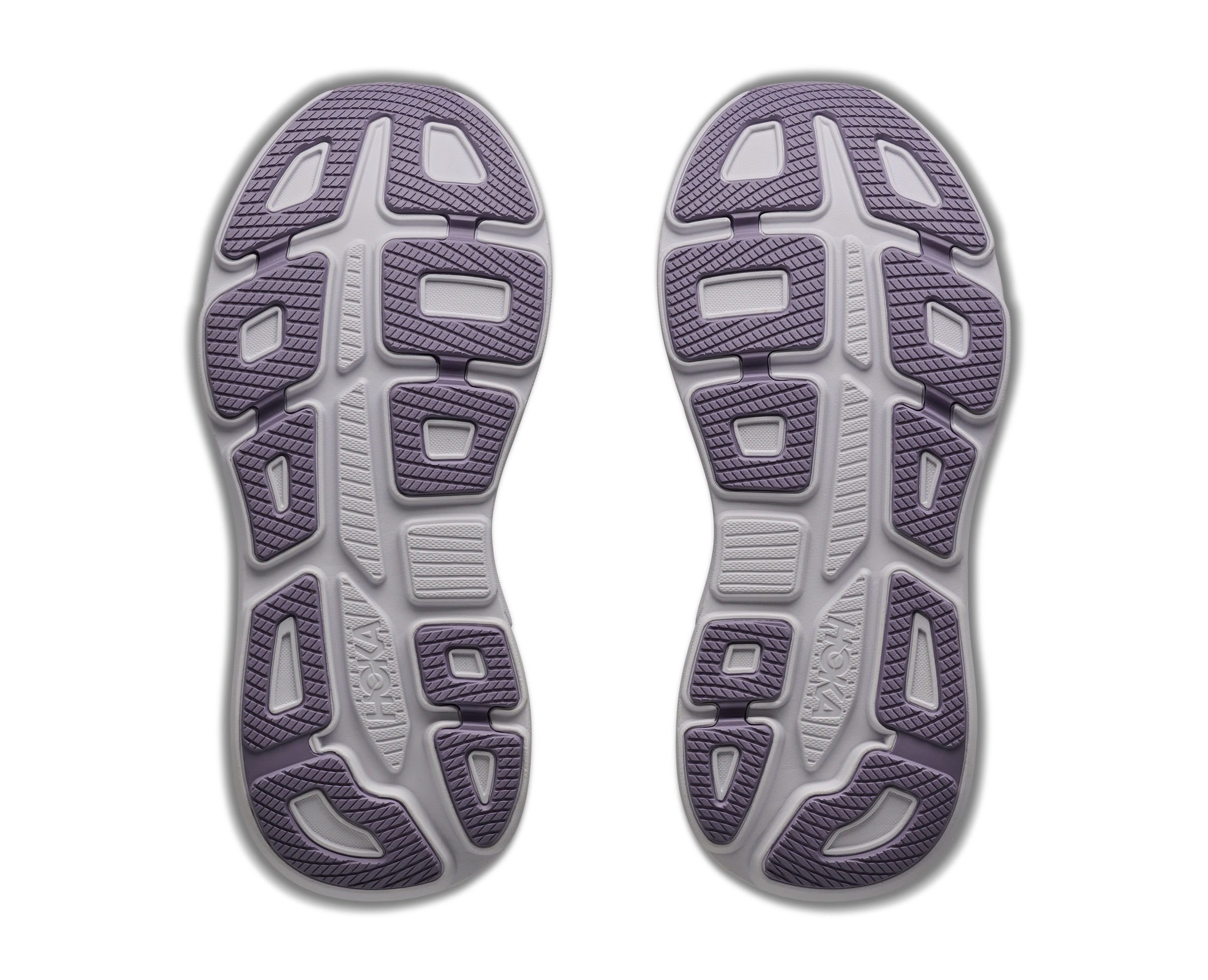 Top view of a pair of gray athletic shoes with purple accents on a white background