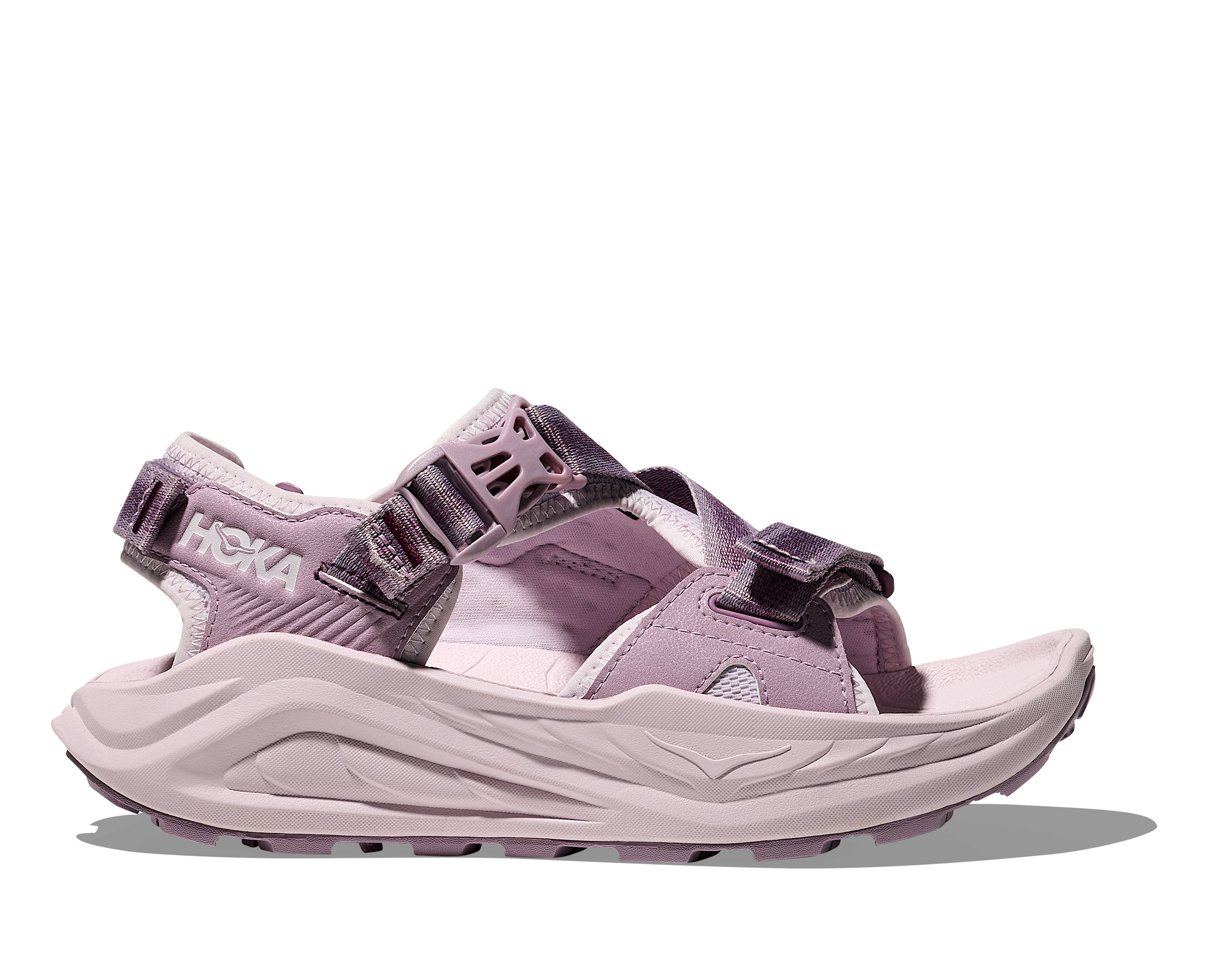 Pink sandal with black straps on a white background