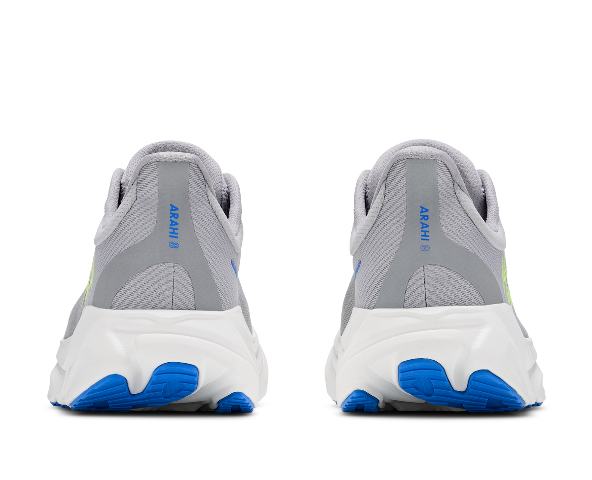 Gray and white running shoes with blue soles on a white background