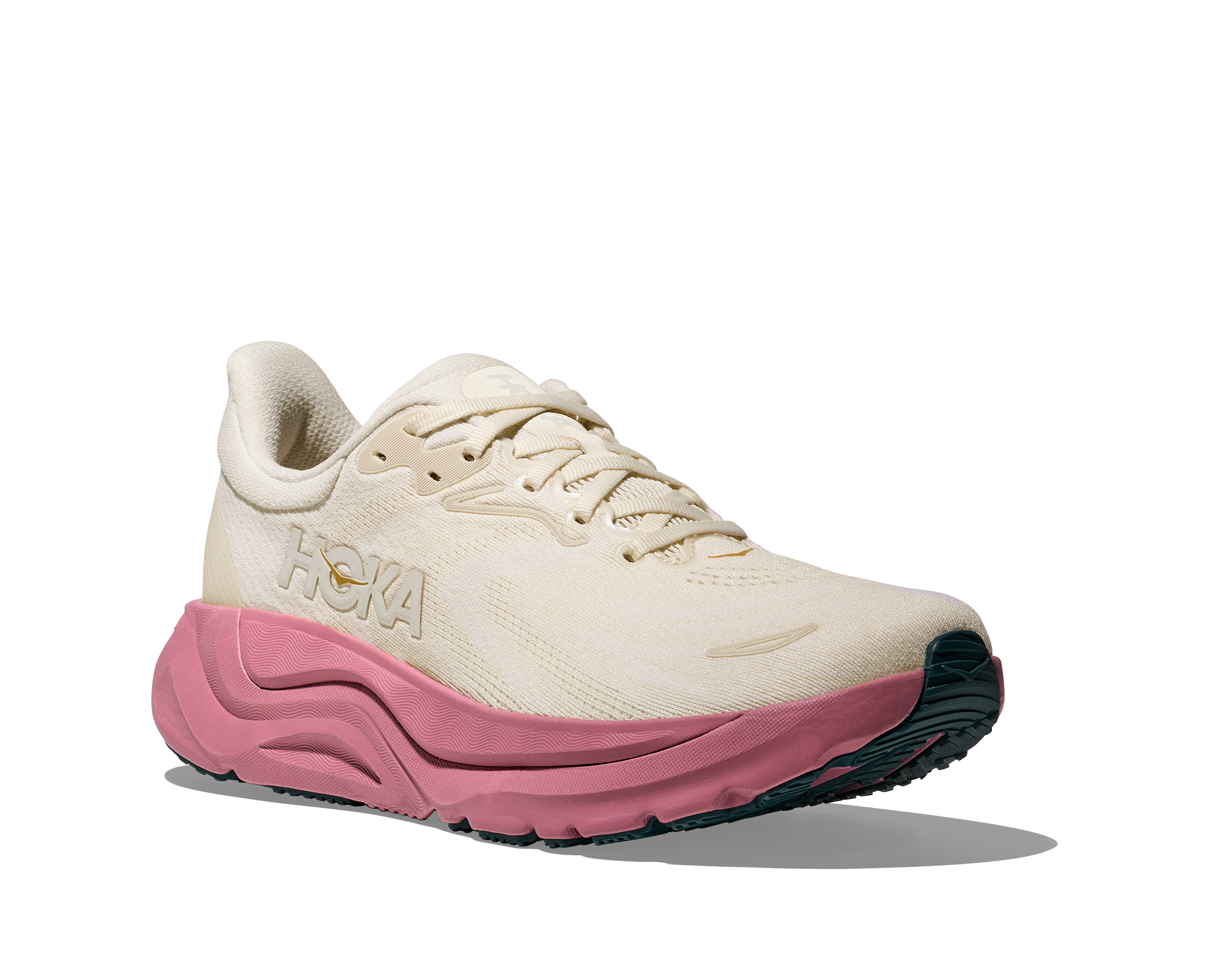 White and pink running shoe with 'Hoka' branding on a white background