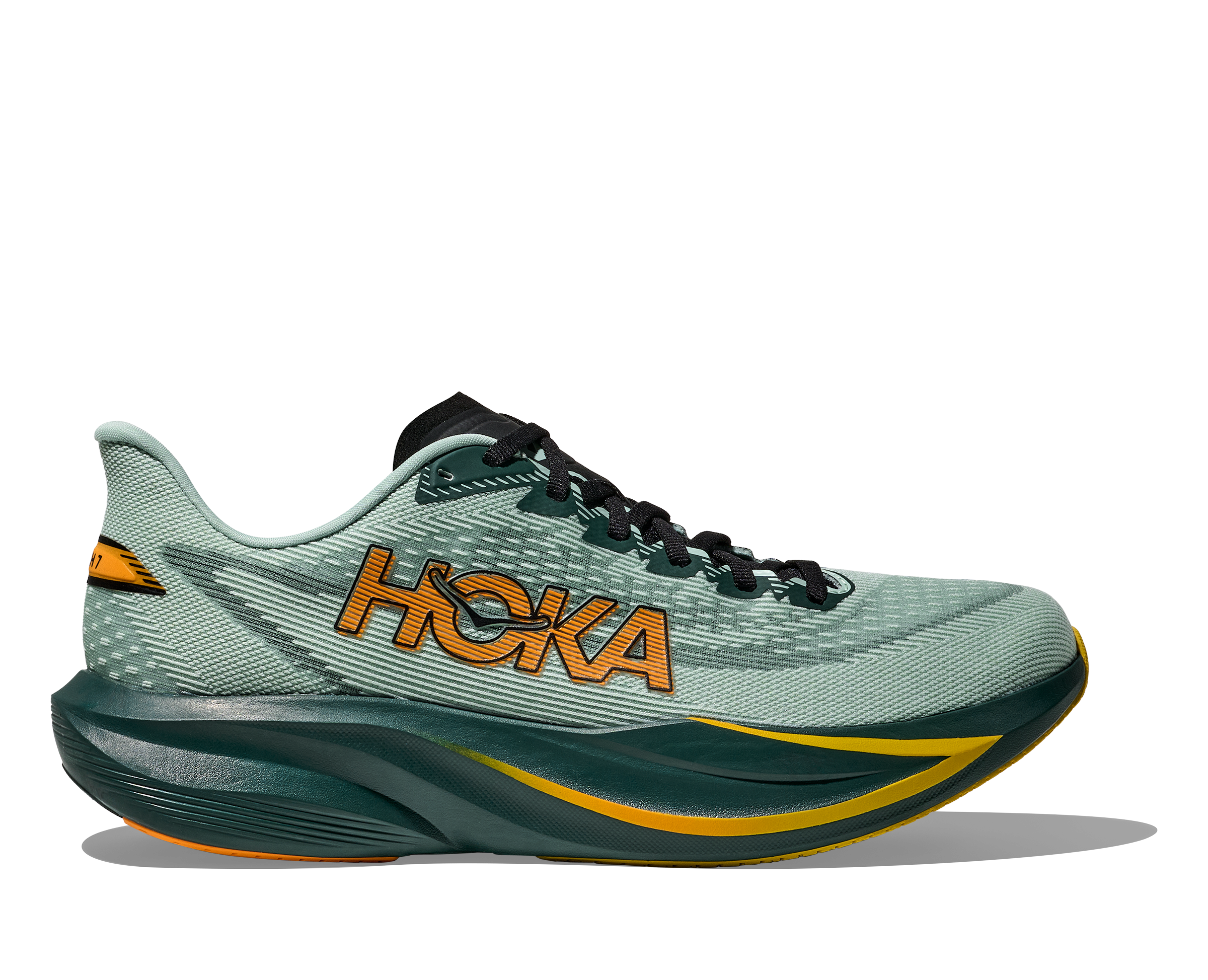 Green running shoe with 'Hoka' branding on a white background
