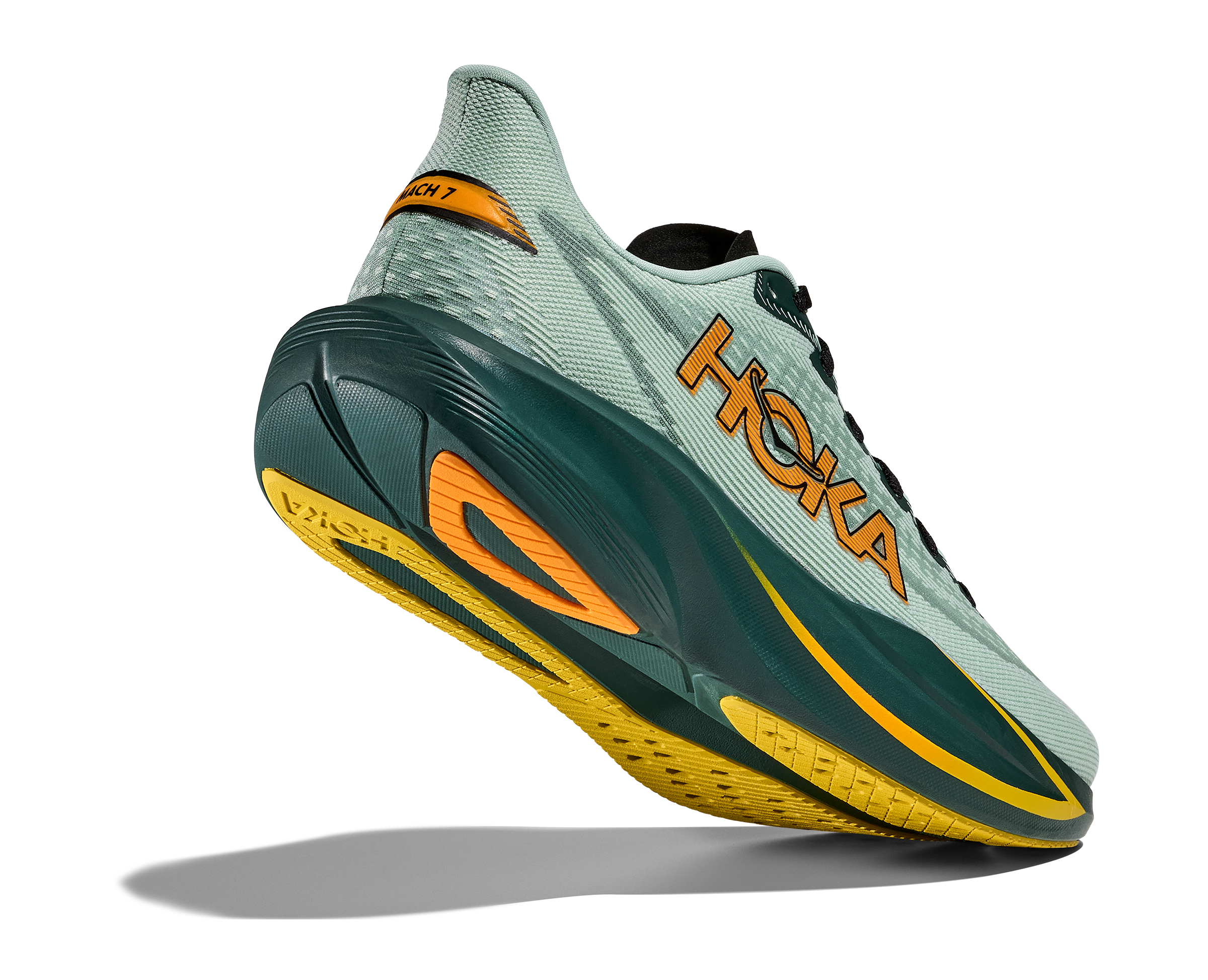 Hoka running shoe with green and orange design on a white background