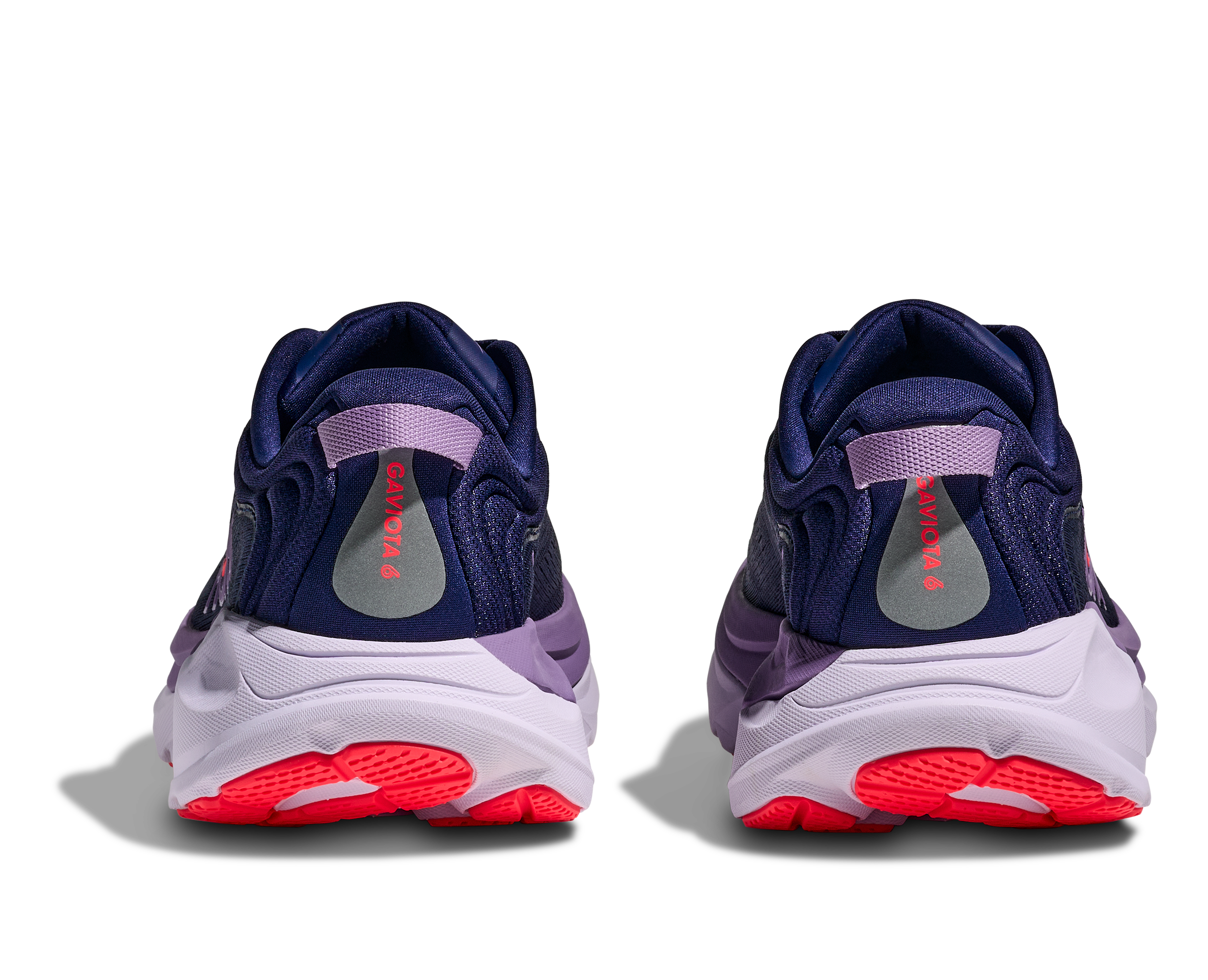 Navy and purple sneakers with red soles on a white background