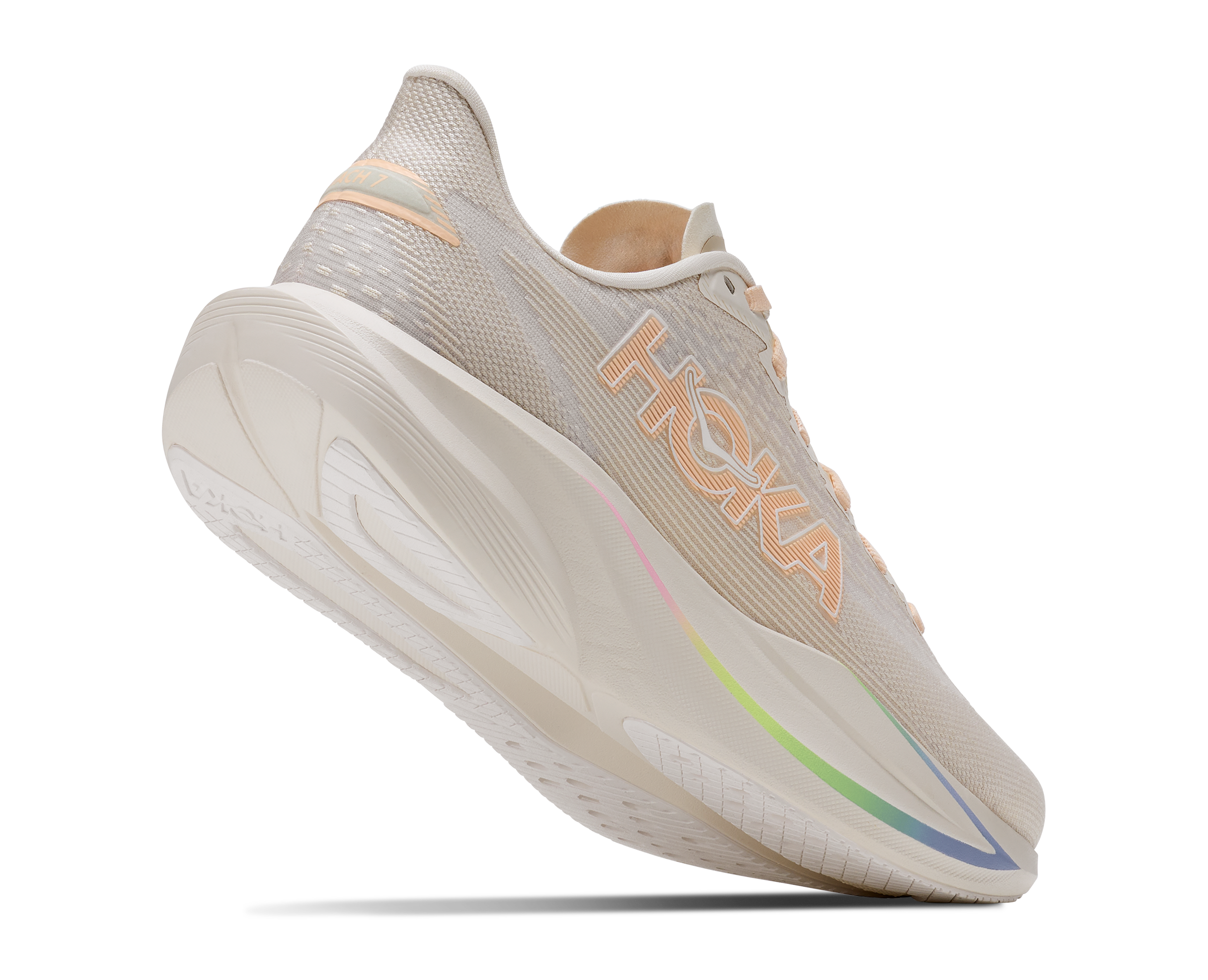 Beige running shoe with colorful sole on a white background