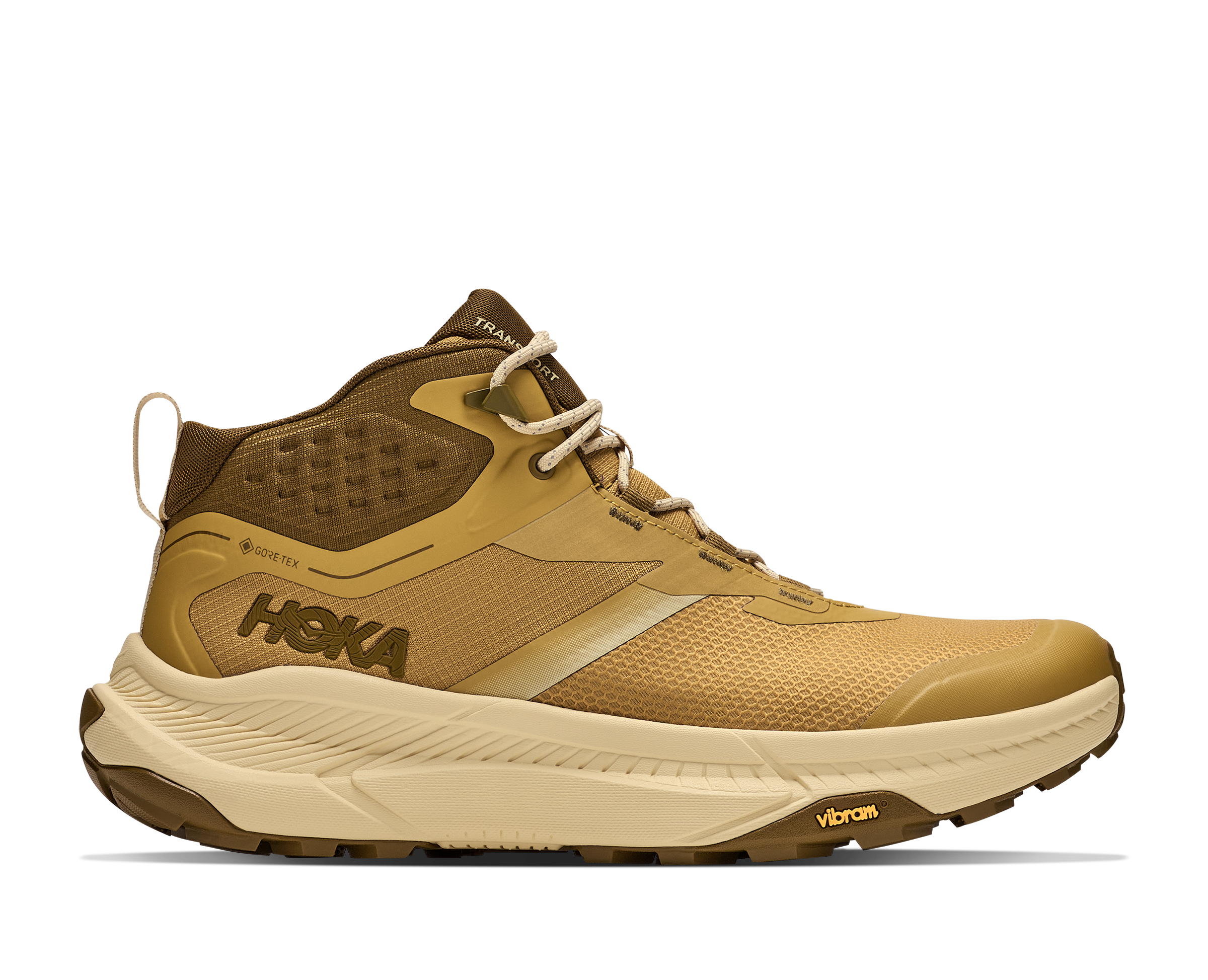A Hoka mid-top trail running shoe in tan and brown with a beige midsole, shown in a side profile on a white background.