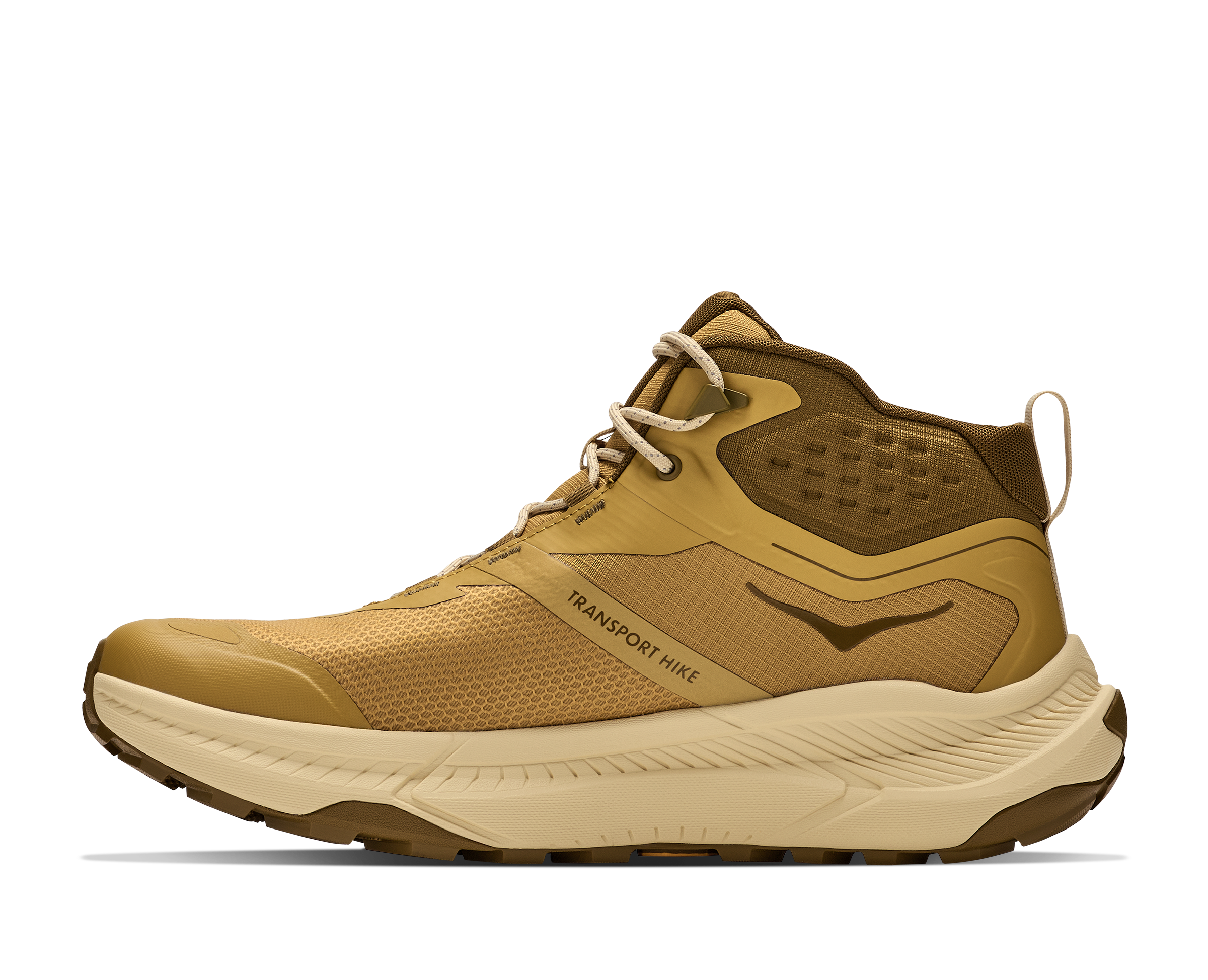 A mid-top hiking shoe in tan and brown, featuring a thick beige midsole and the text 'TRANSPORT HIKER' printed on the side, shown against a plain white background.