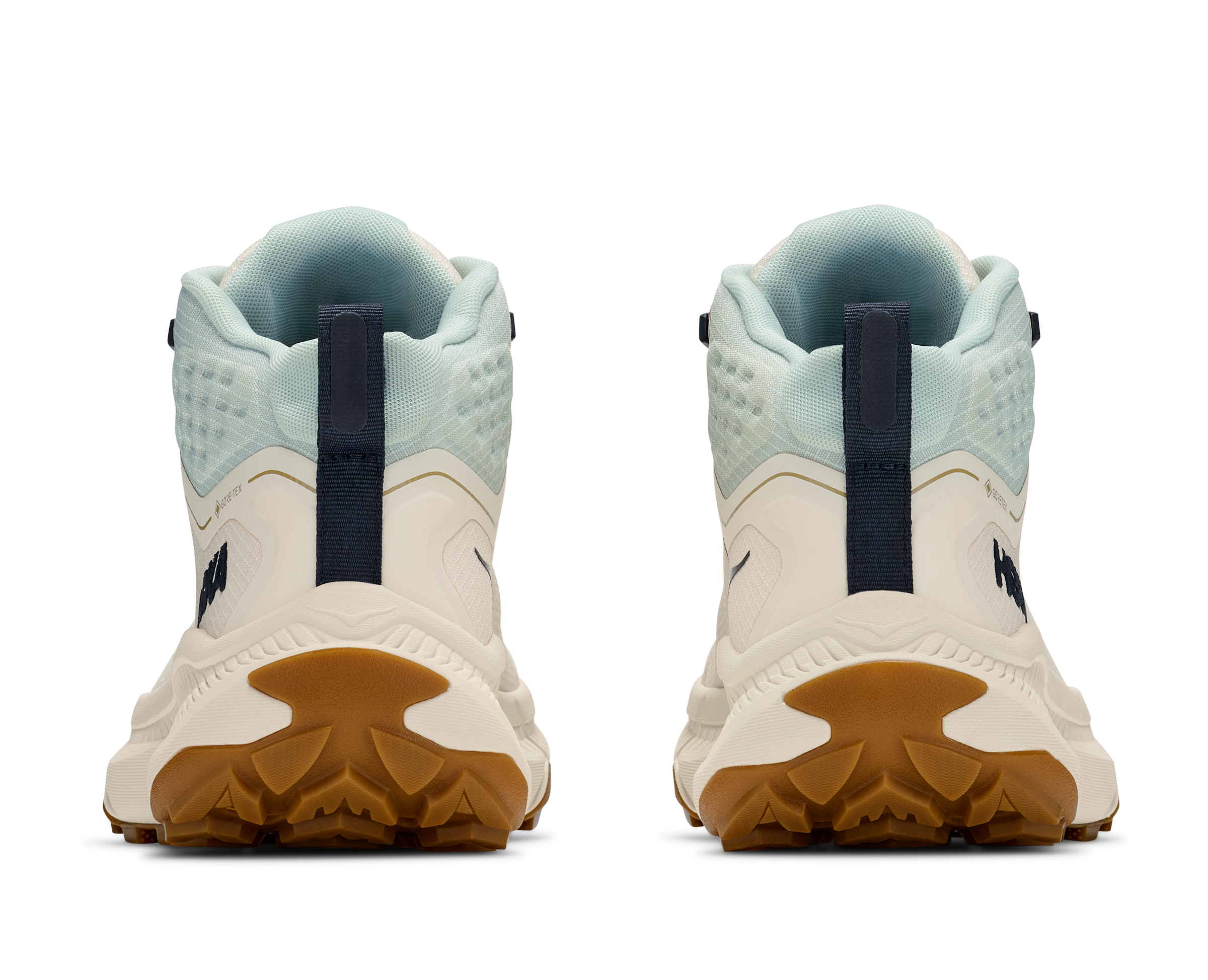Back view of a pair of white and blue sneakers with brown soles on a white background