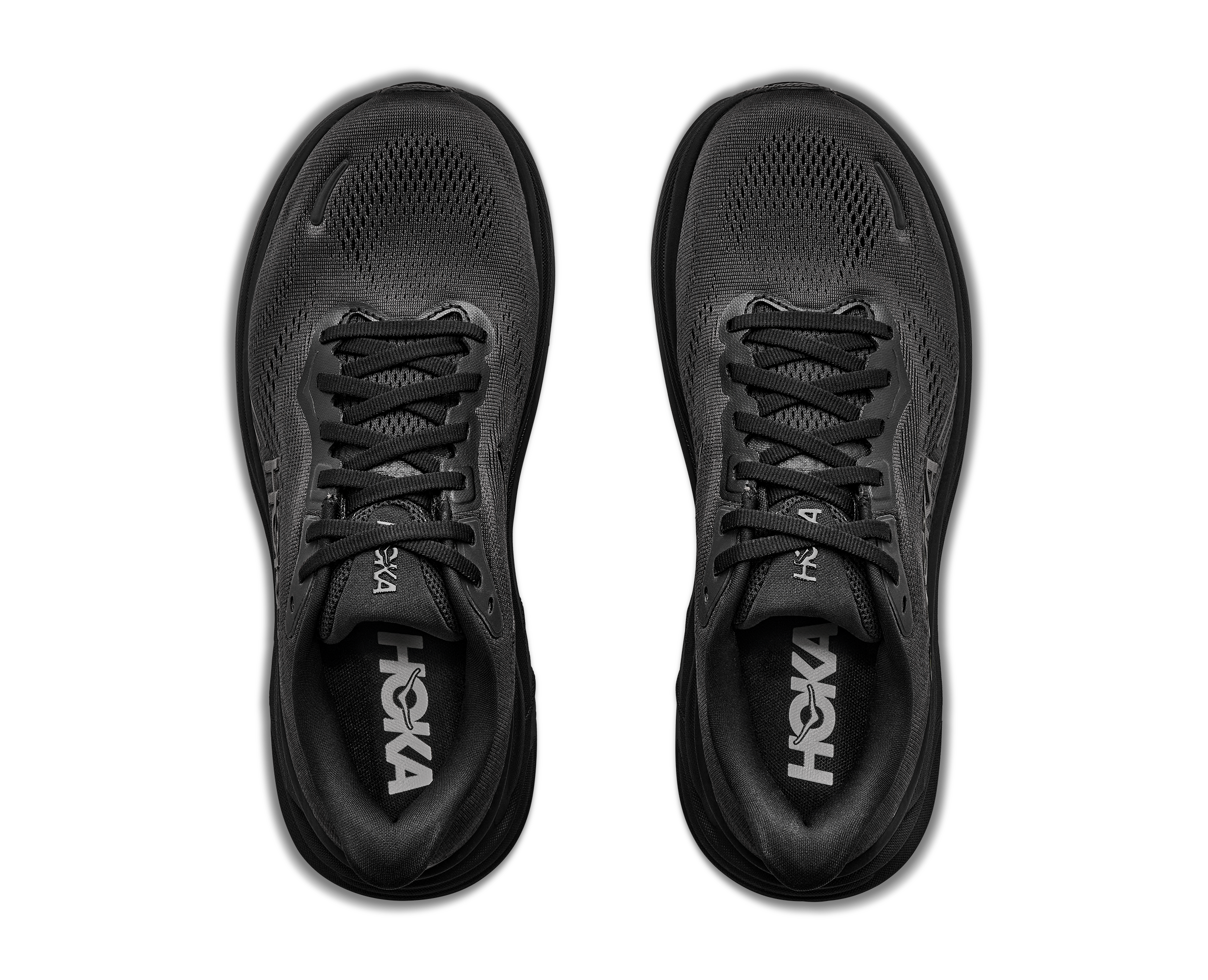 Black running shoes with 'Hoka' branding on a transparent background