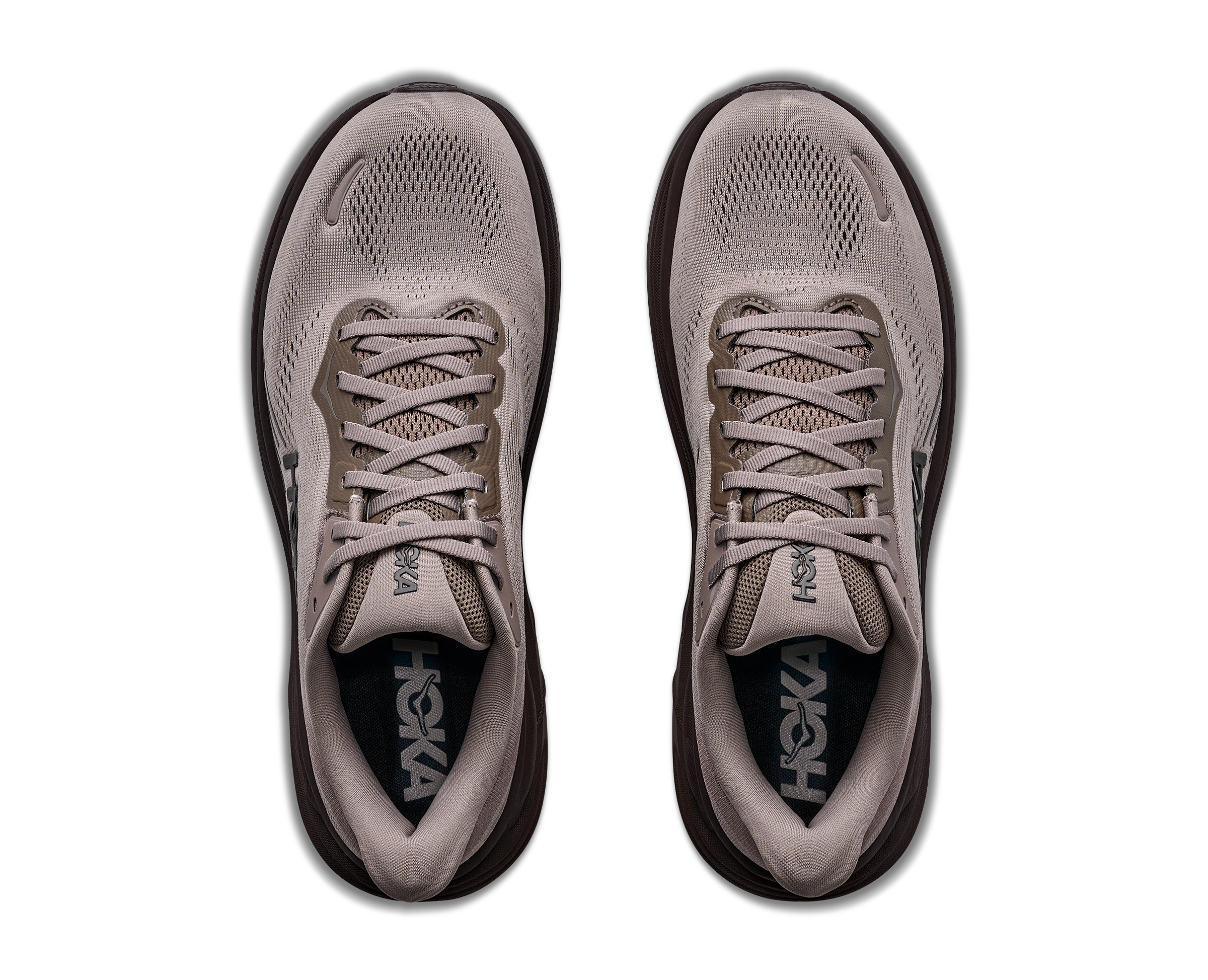 Pair of gray athletic shoes with brand logo on a white background