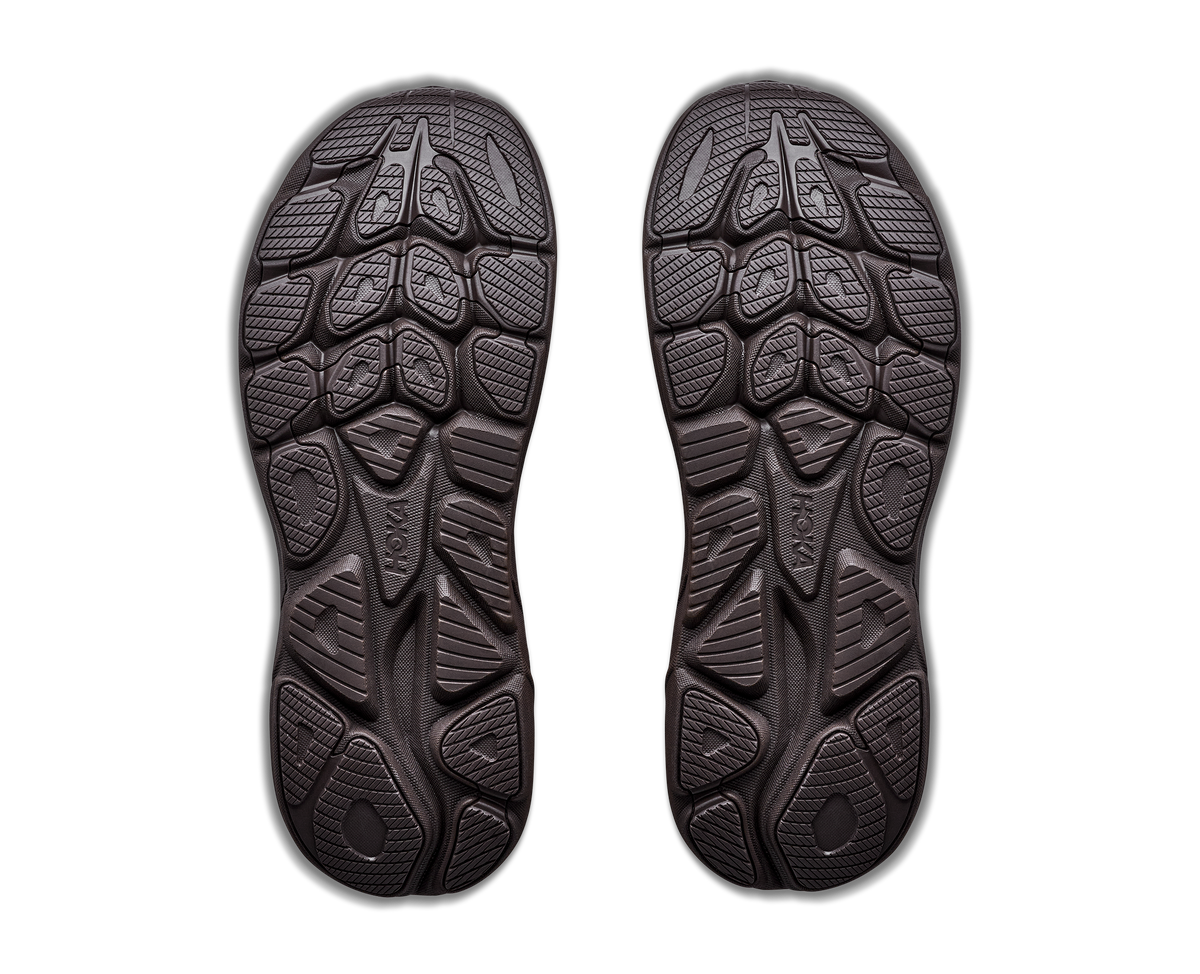 Black shoe sole with tread pattern on a white background