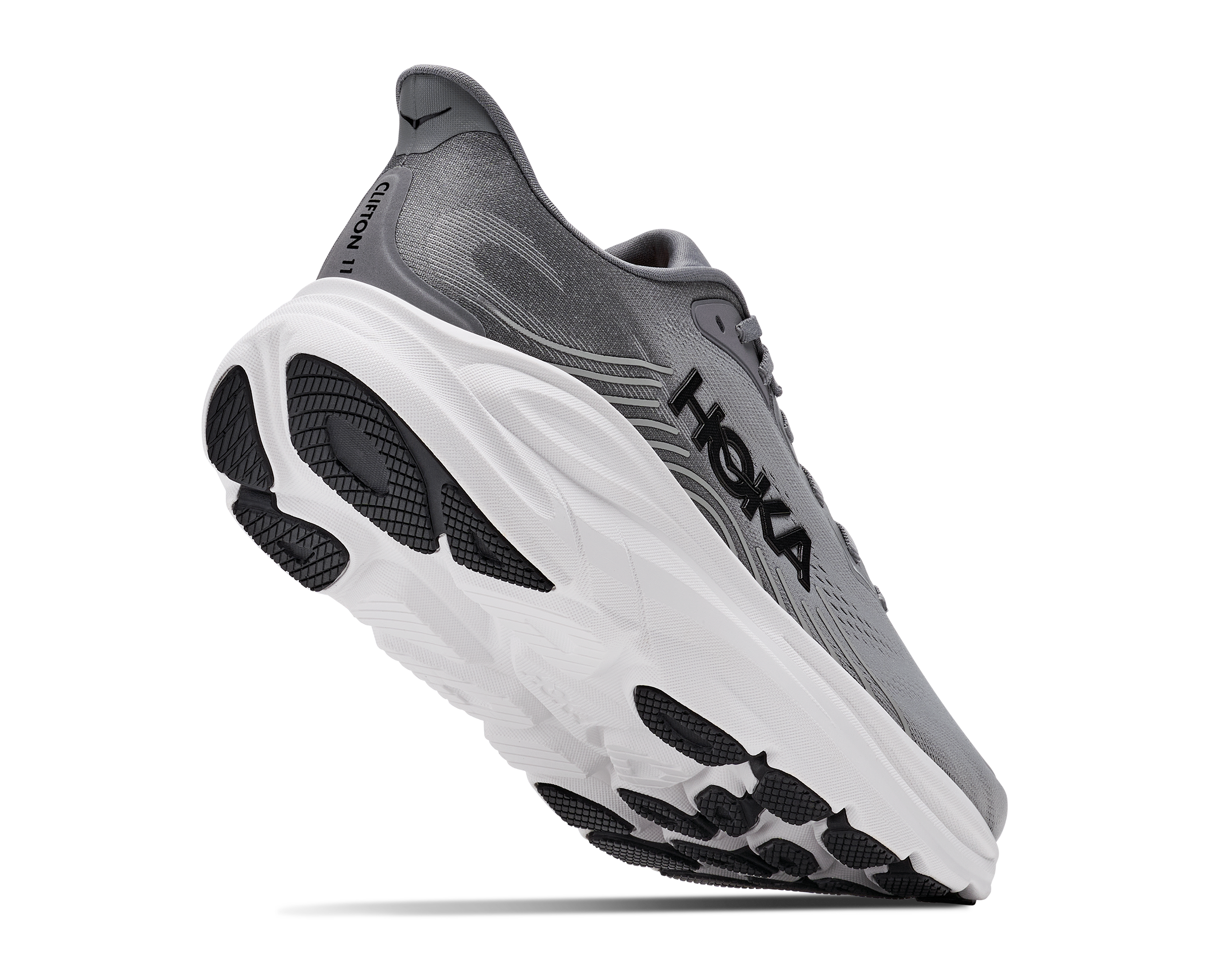 Gray running shoe with white sole on a white background