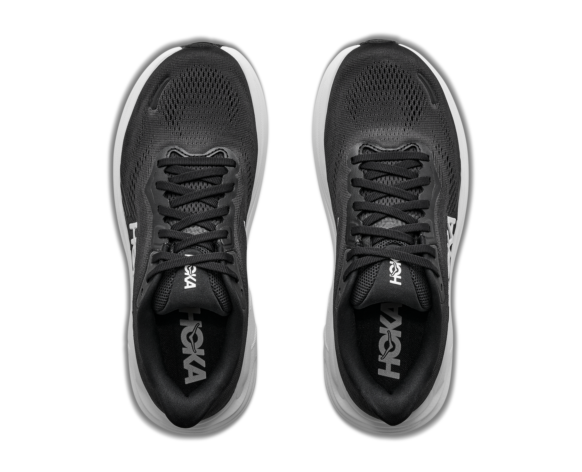 Black running shoes with white soles on a white background