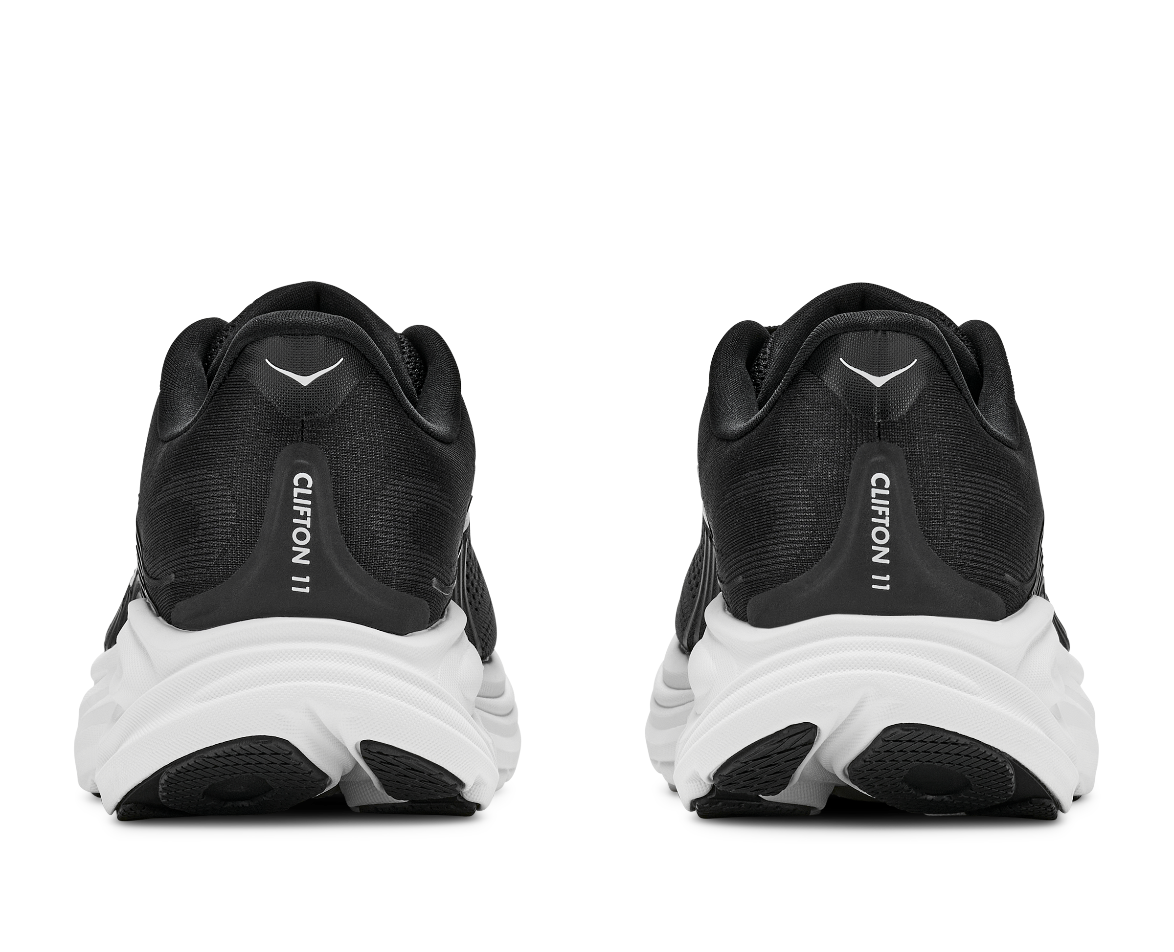 Black running shoes with white soles on a white background