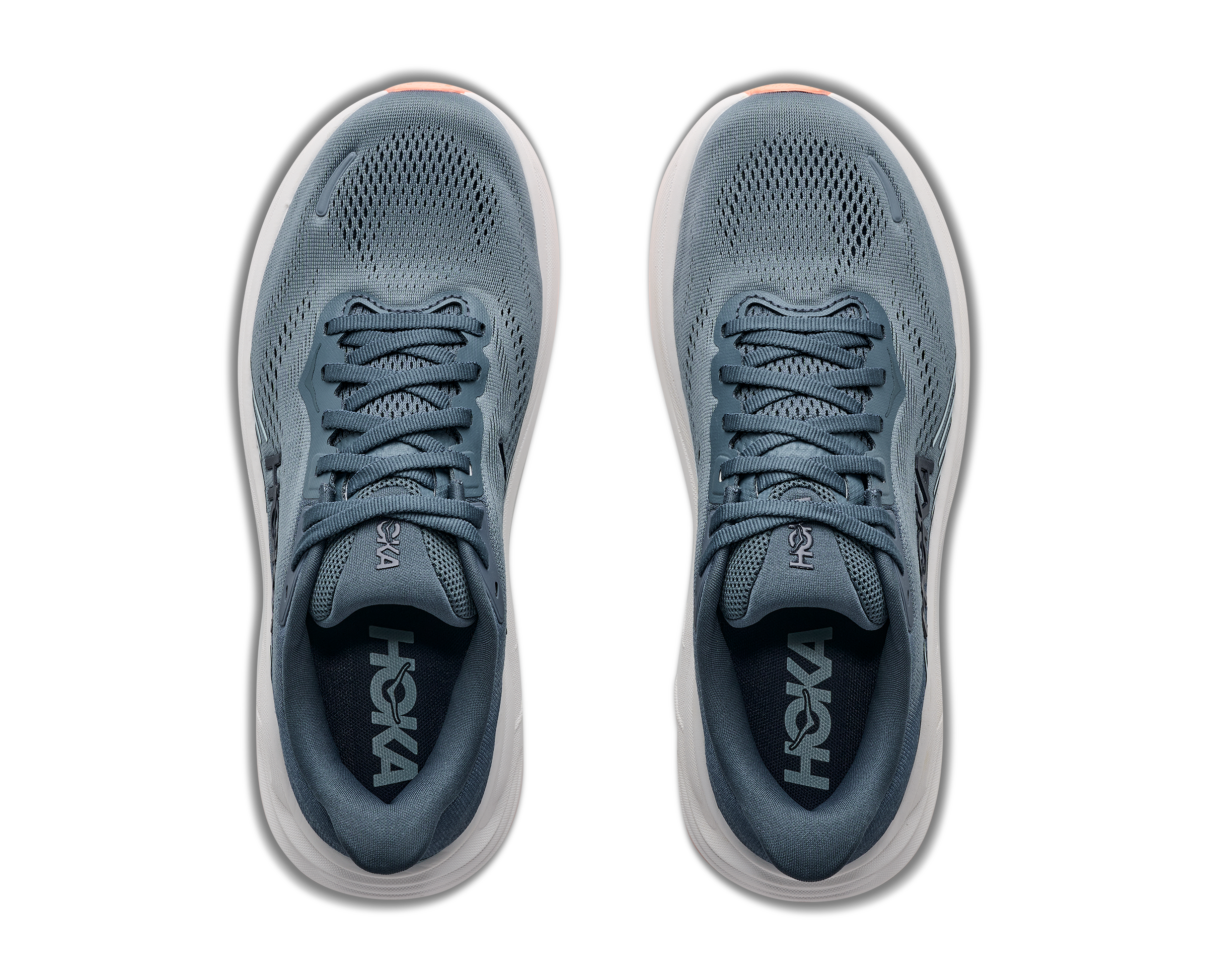 Pair of gray running shoes with 'Hoka' branding on a white background