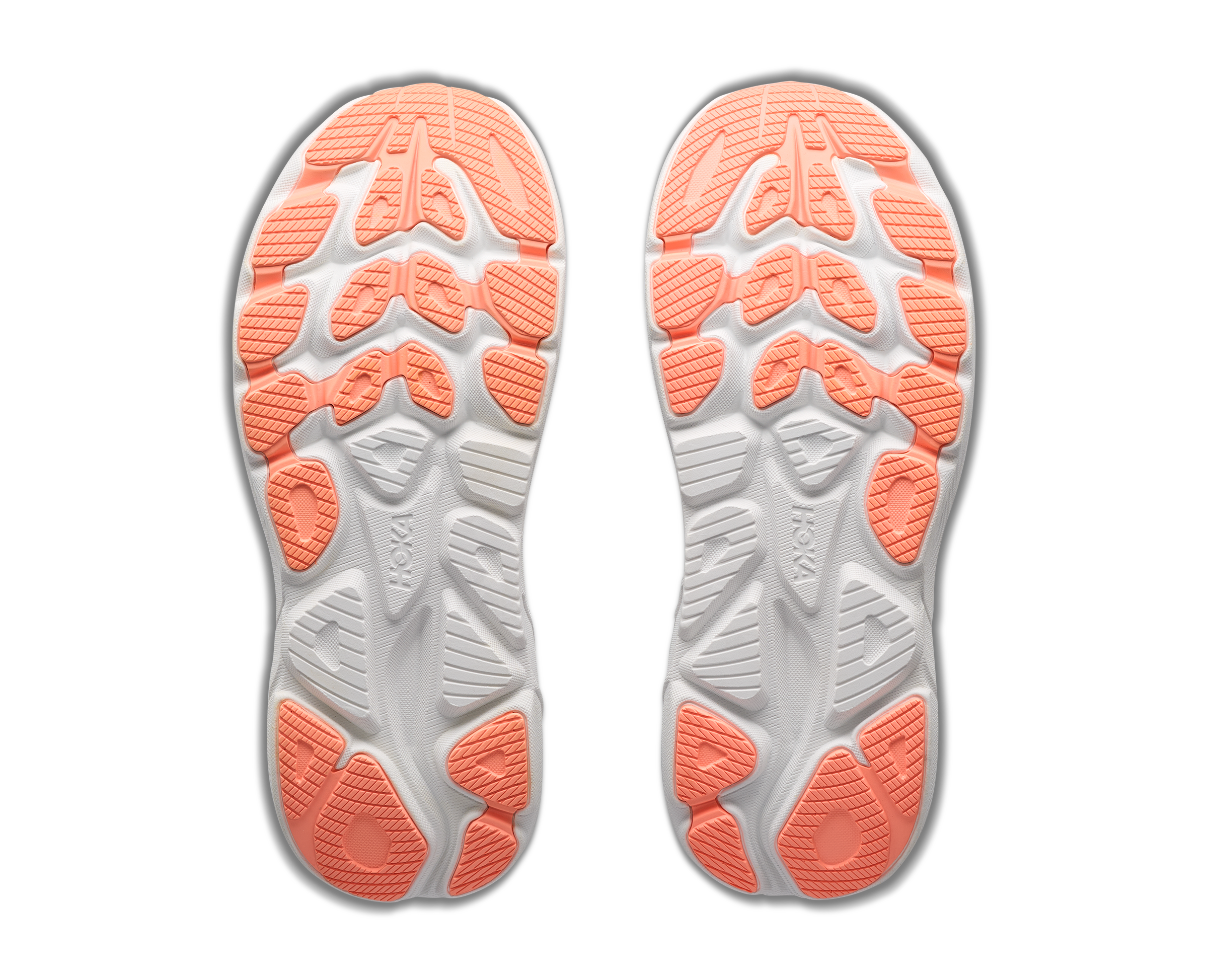 White shoe insoles with orange rubber outsole on a white background