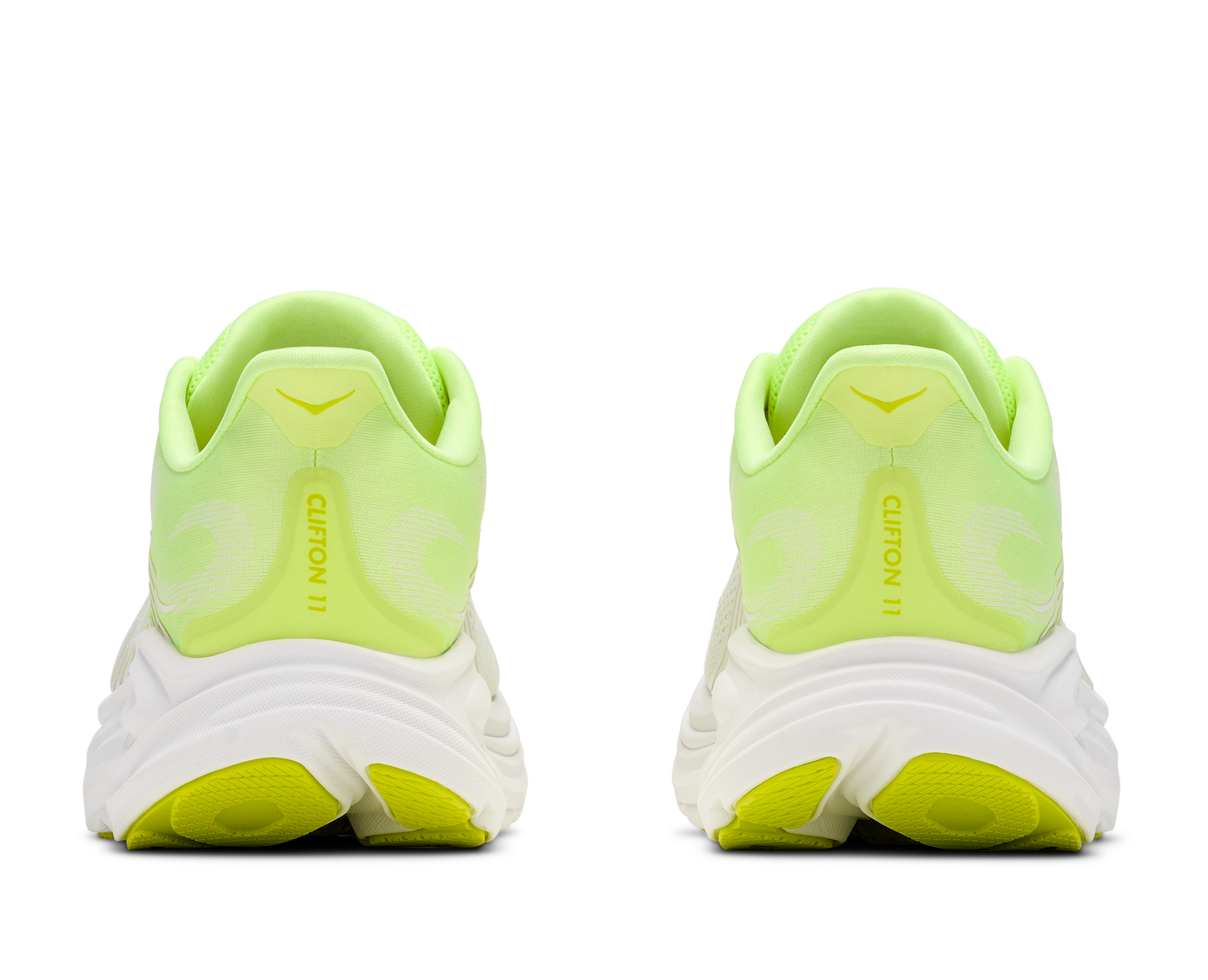 Pair of neon green running shoes on a white background