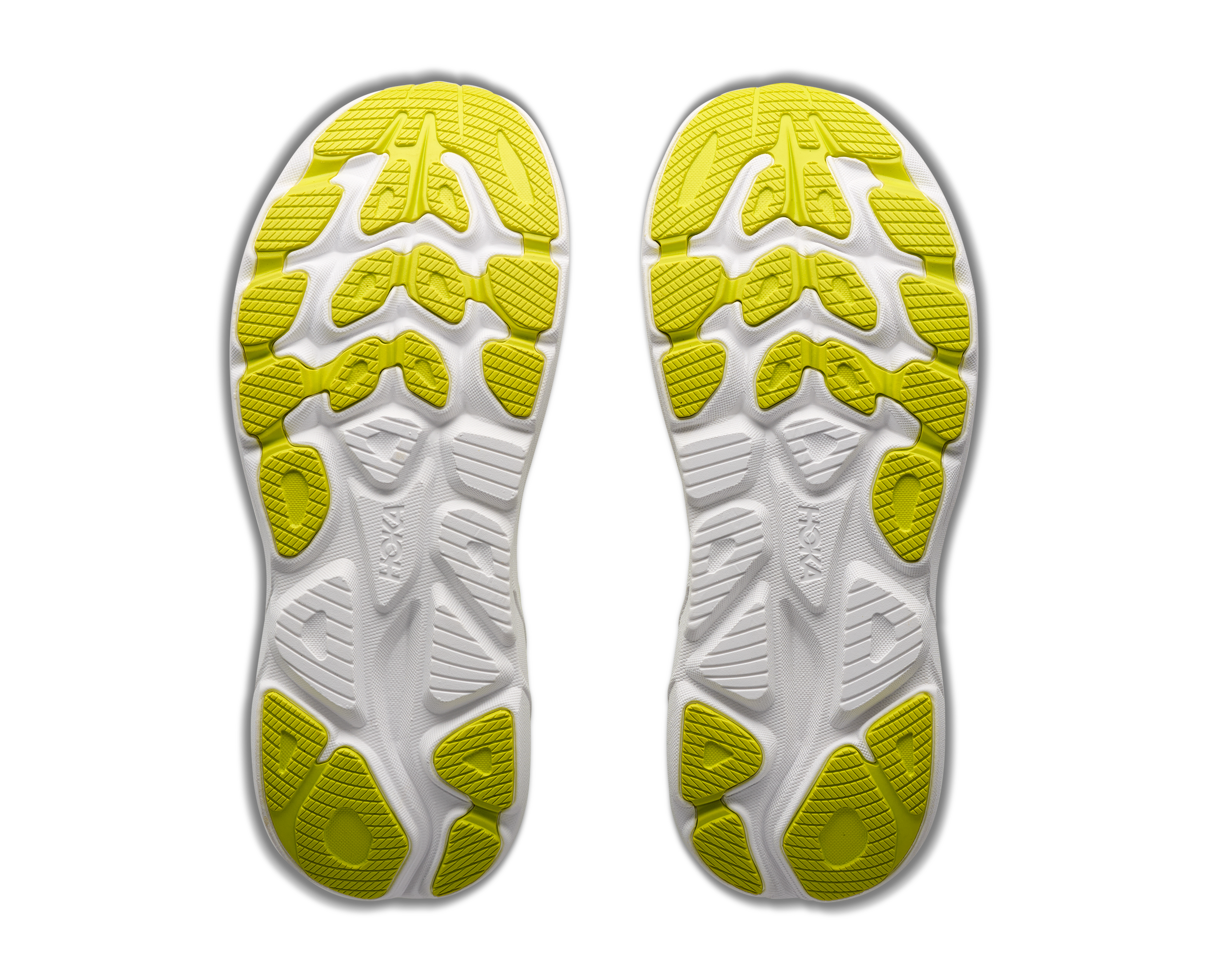 White shoe insoles with yellow textured sole on a white background