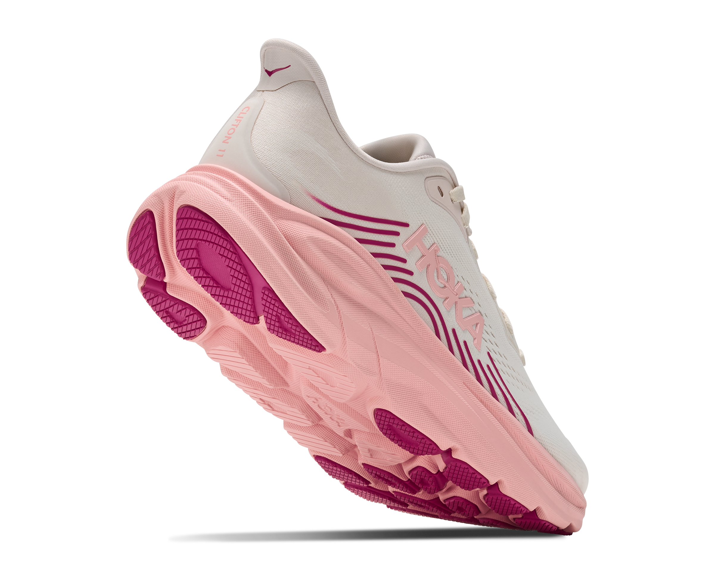Pink and white sneaker with visible brand logo on a white background