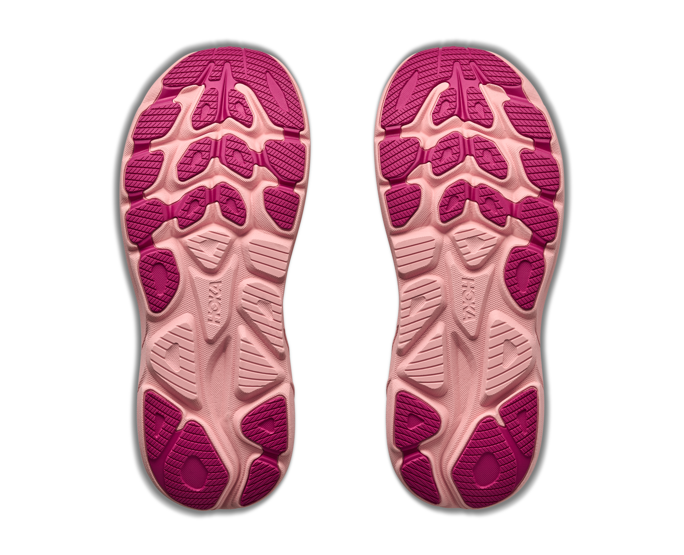 Pink and beige shoe sole with textured pattern on a white background