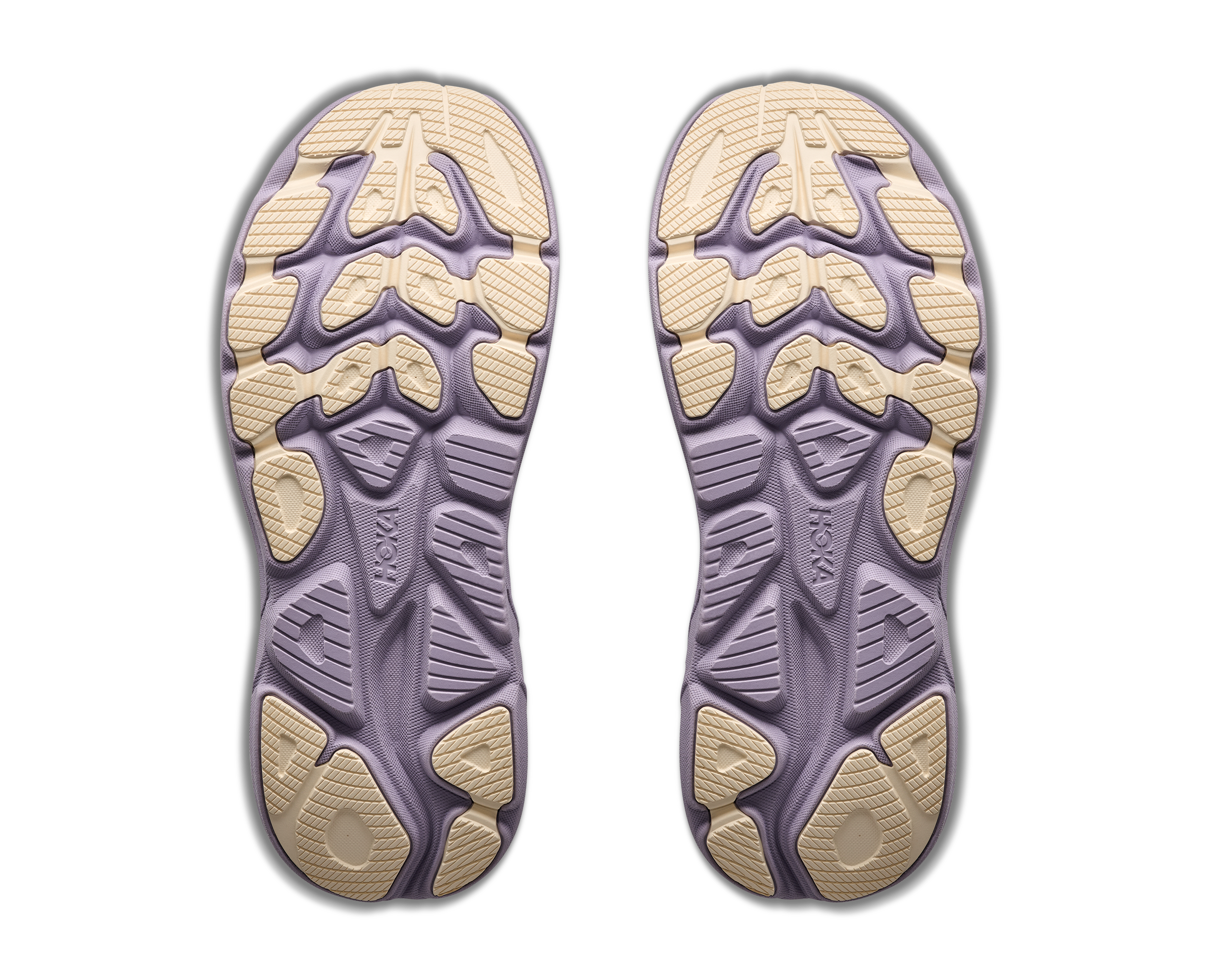 Pair of purple and beige shoe insoles on a white background