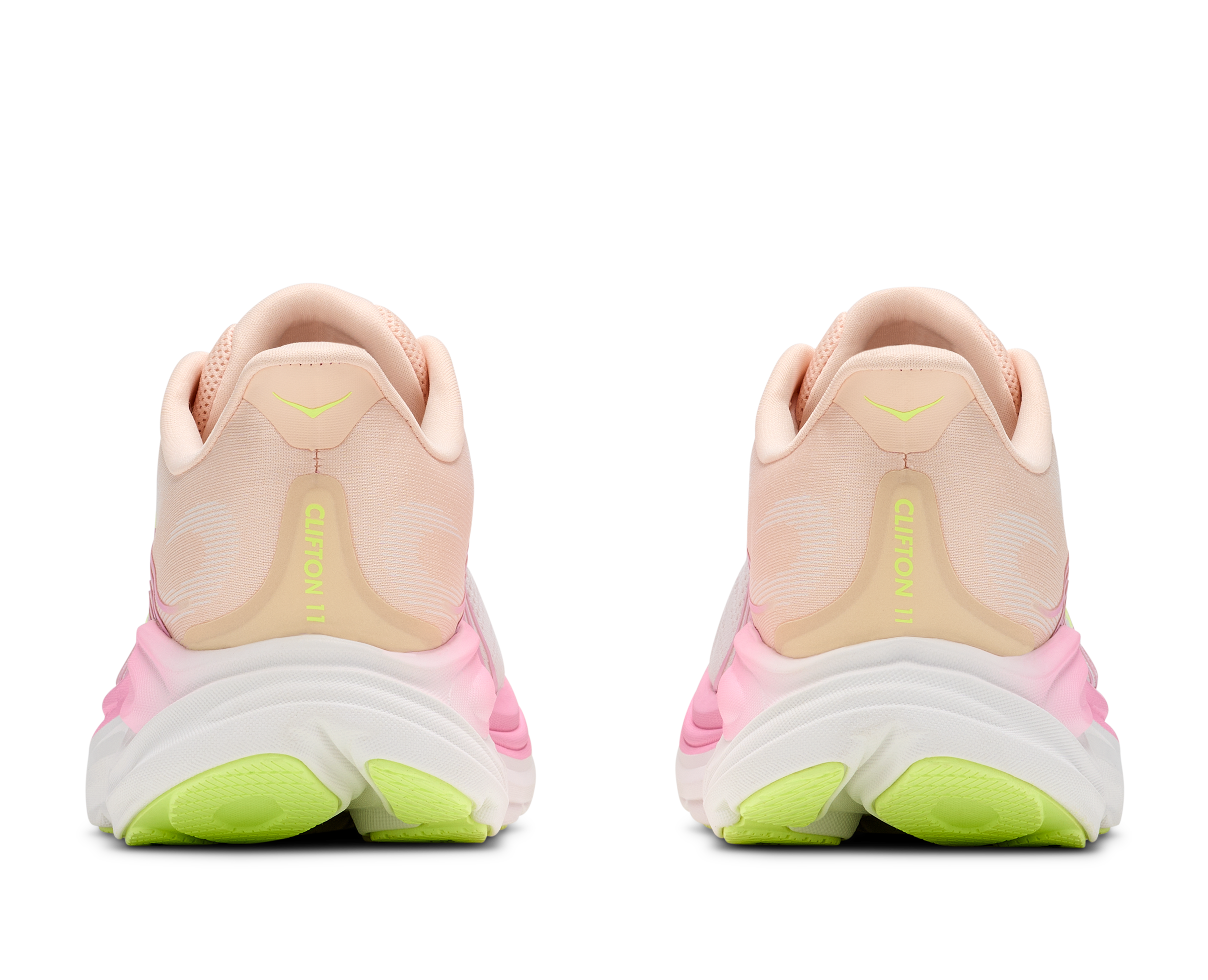 Pair of pink and green running shoes on a white background