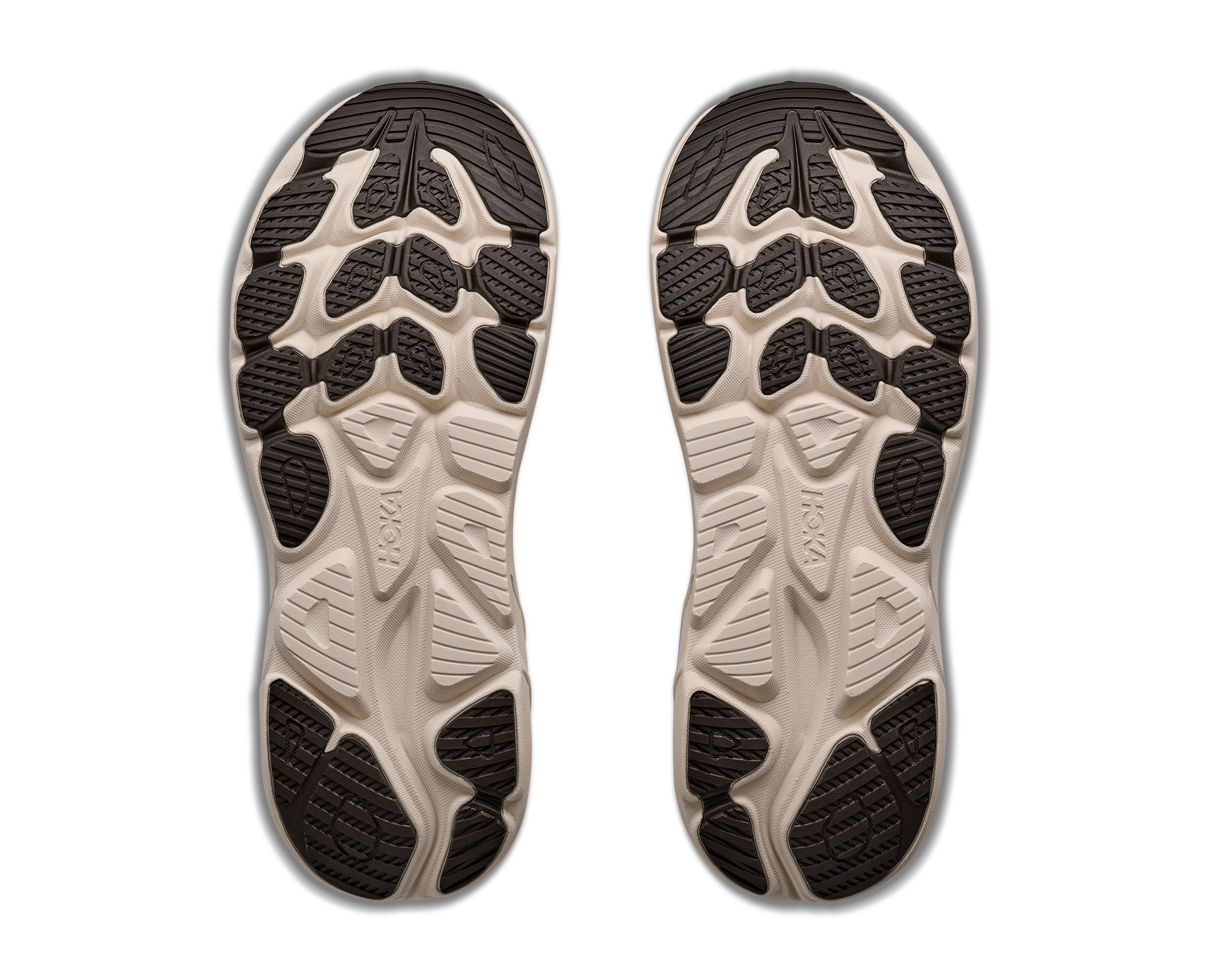 Close-up of a pair of shoes with tread pattern on a white background