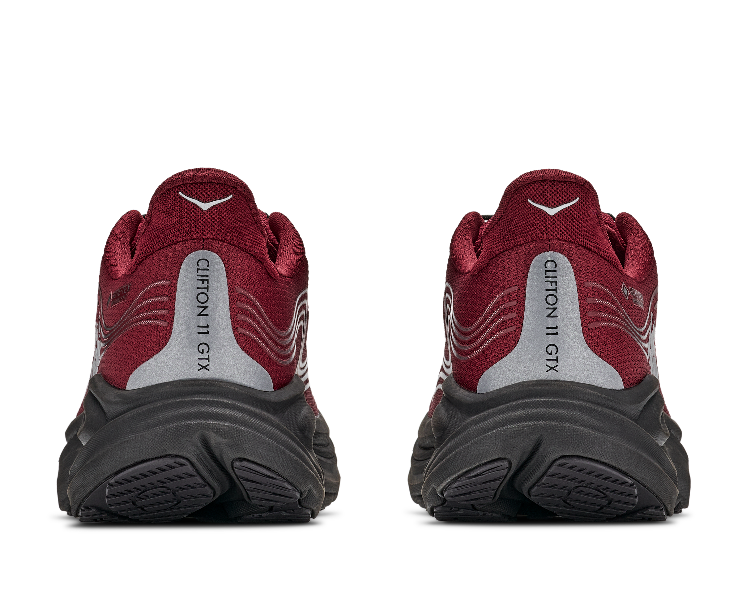 Red hiking boots with black soles on a white background
