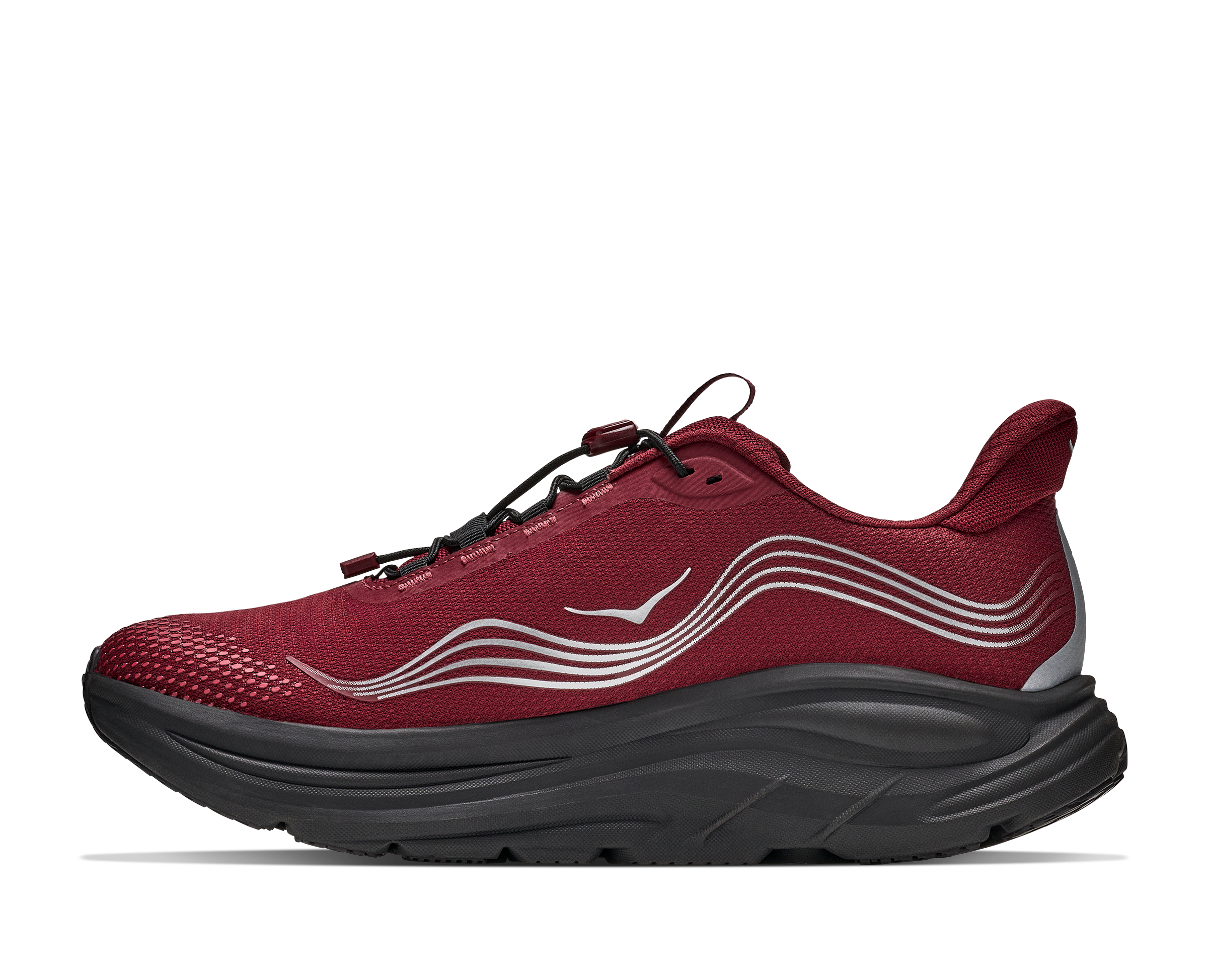 Red athletic shoe with black sole on a white background