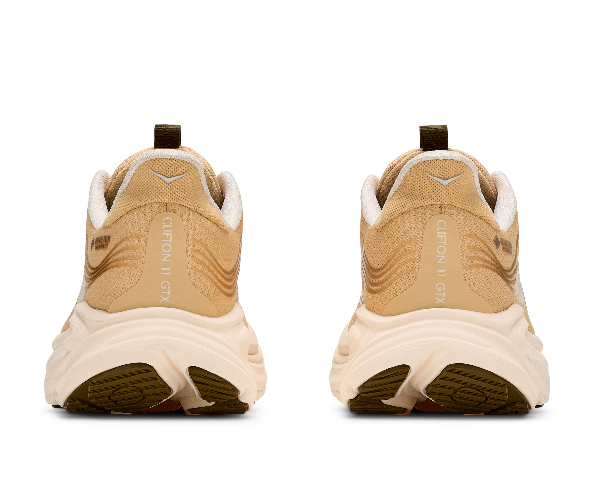 Beige sneakers with white soles on a white background