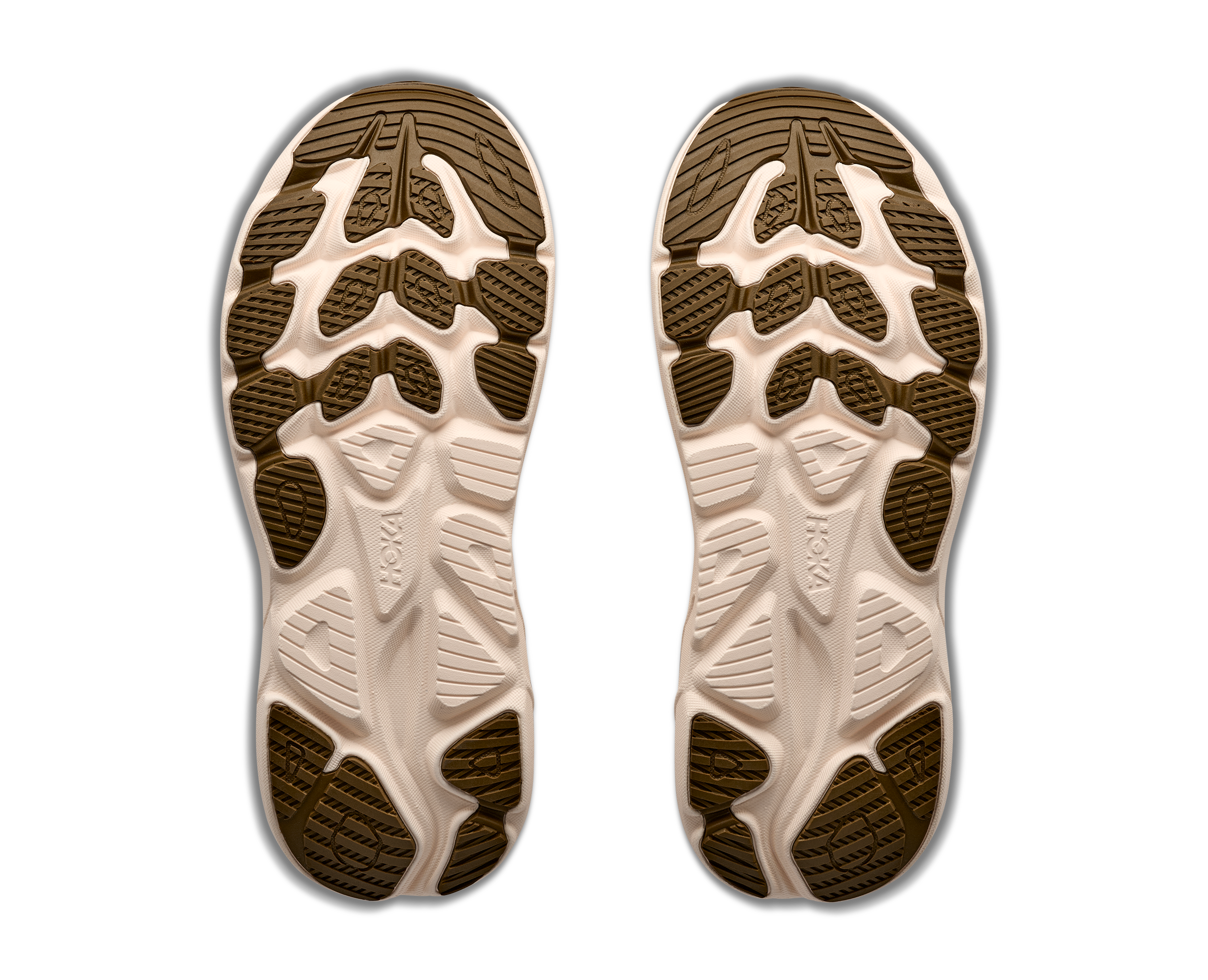 Close-up of a pair of shoe soles with a brand logo on a white background