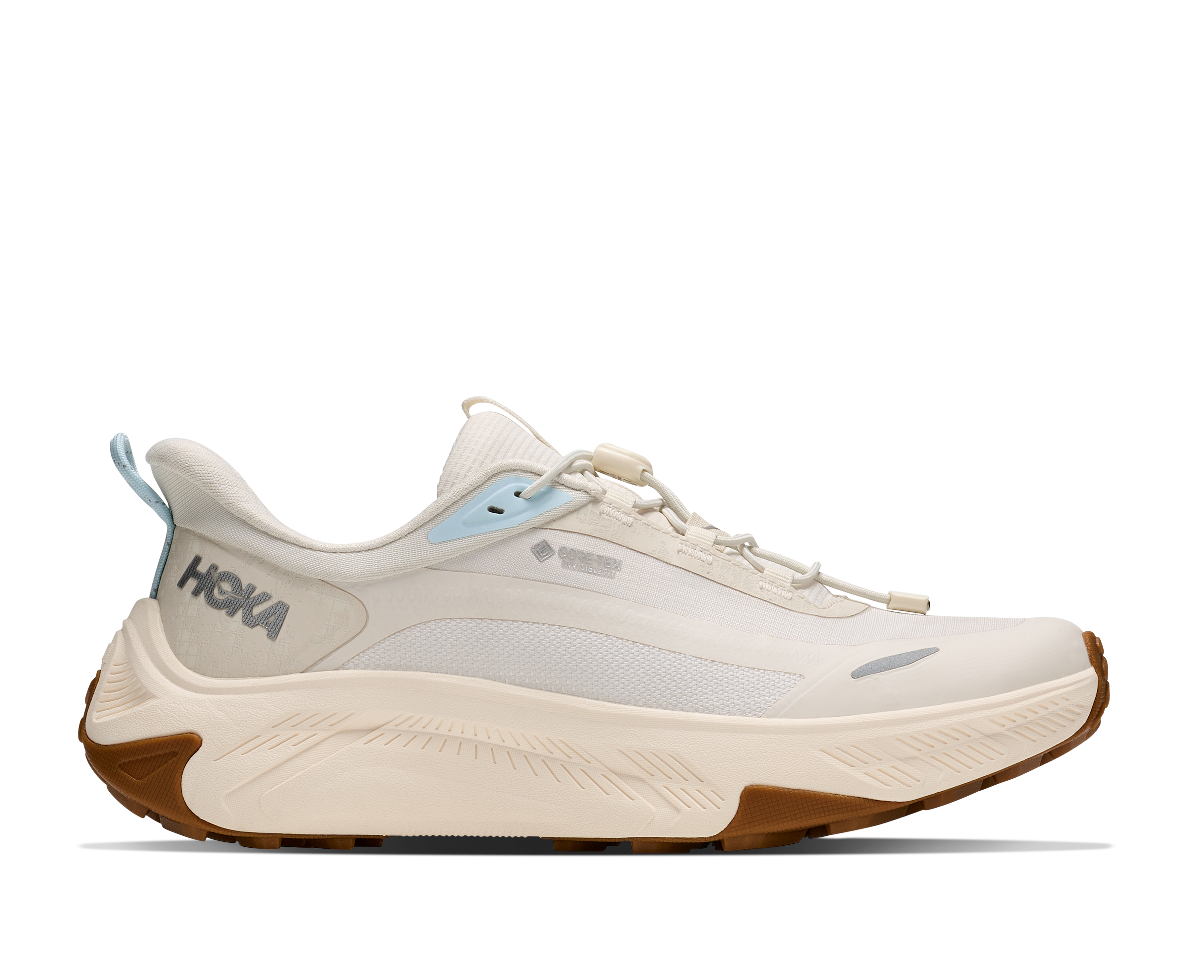 White running shoe with brown sole on a white background