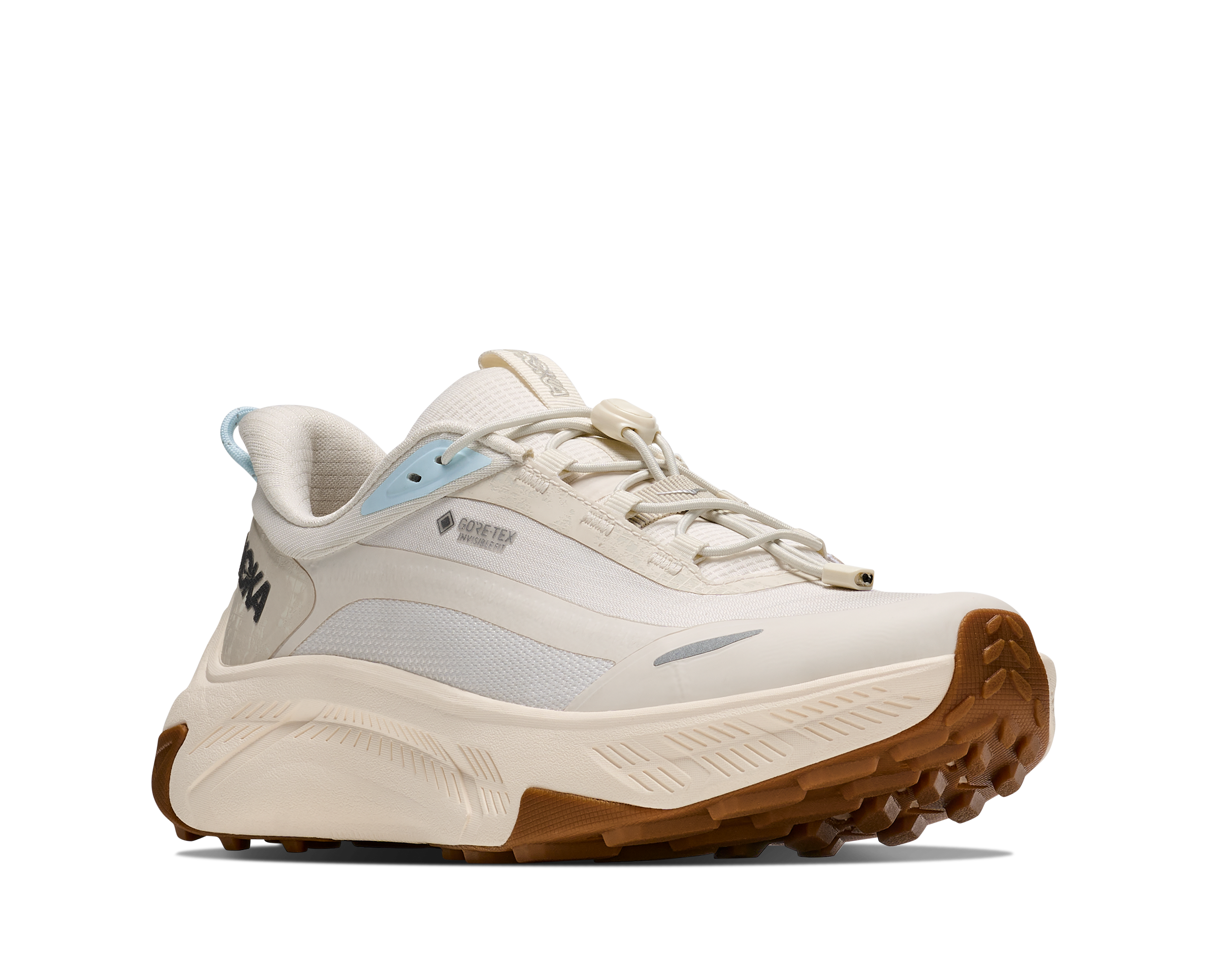 White sneaker with brown sole on a white background