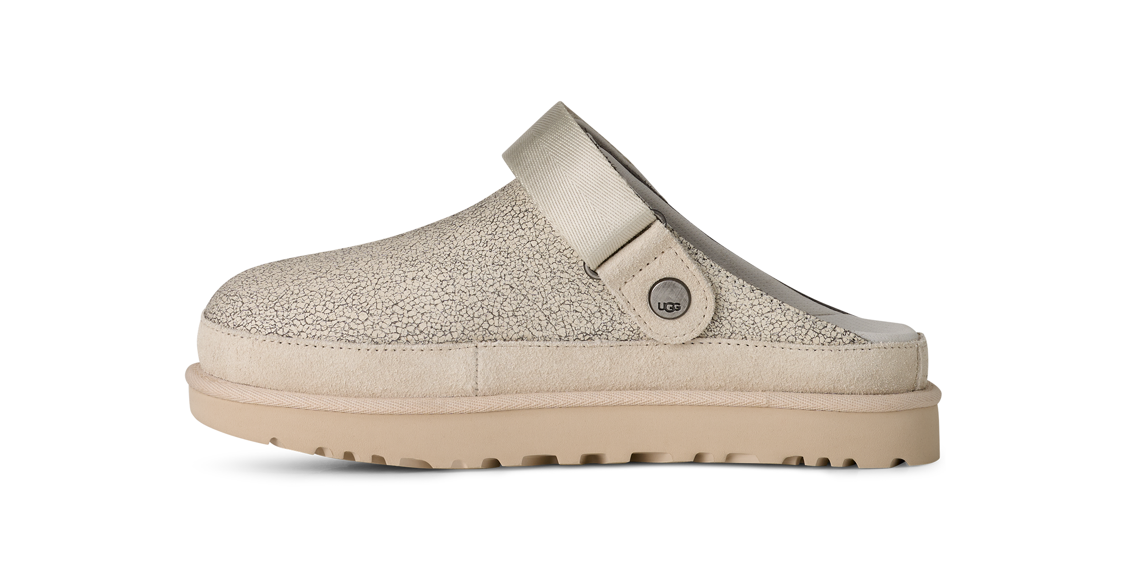 Beige slip-on shoe with a strap on a white background
