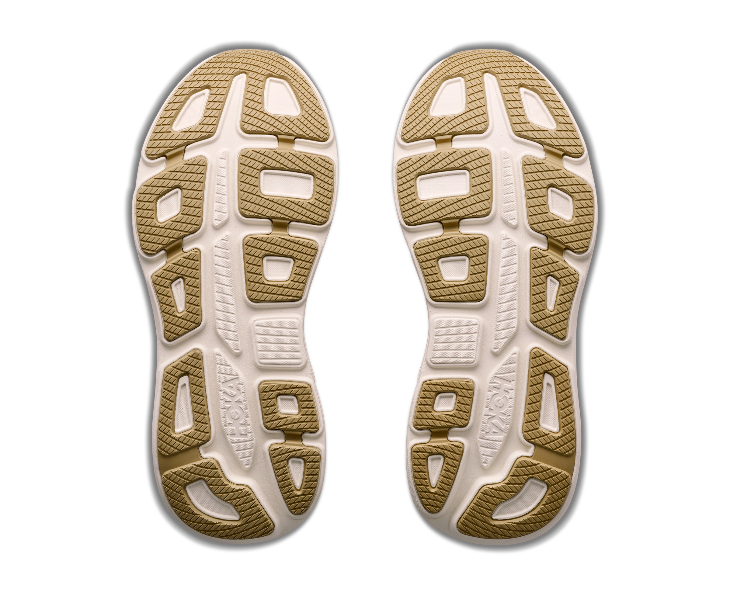Close-up of beige shoe soles with a textured pattern on a white background