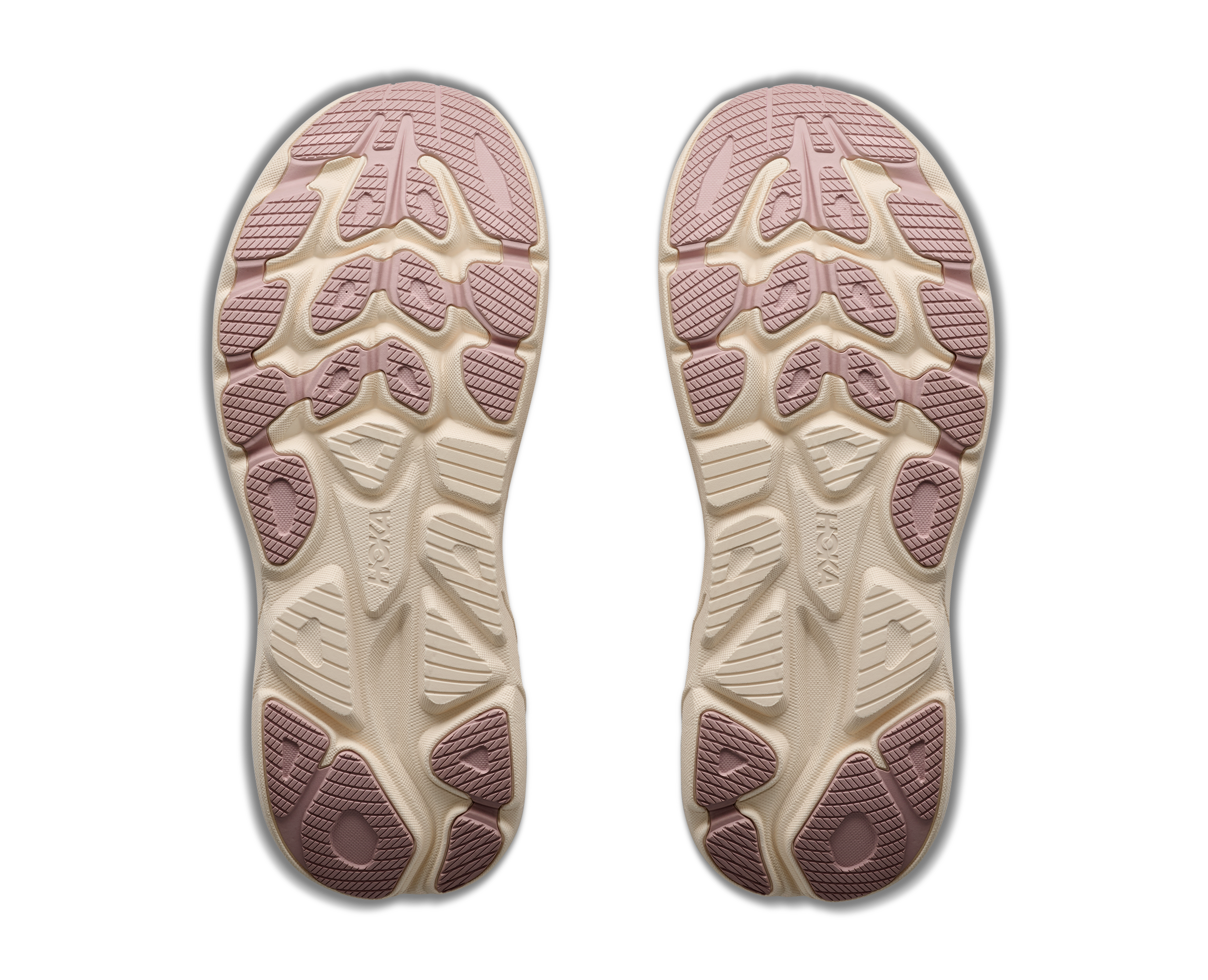 Two shoe soles with a textured pattern on a black background
