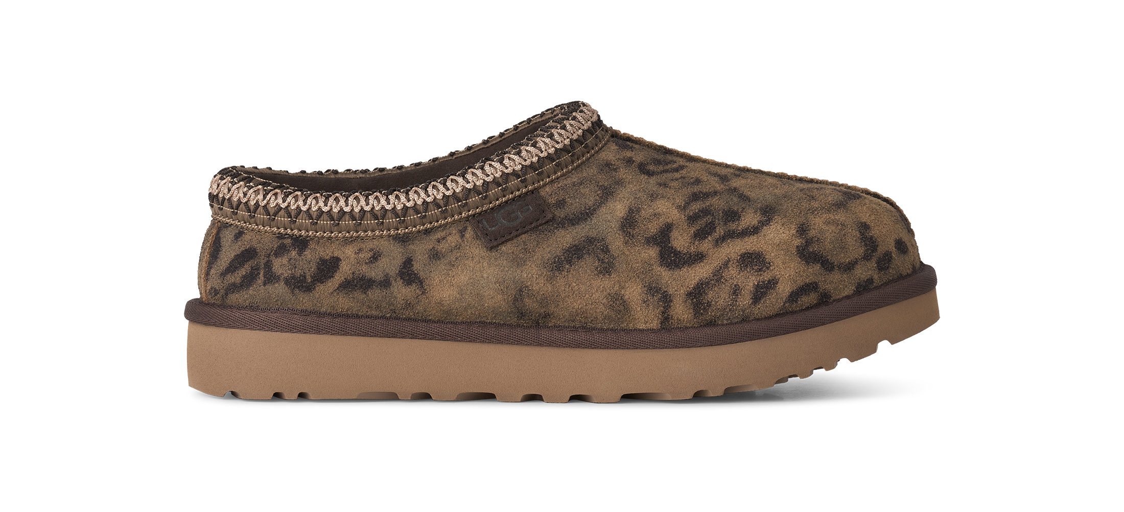 Brown leopard print slipper with a brown sole on a white background