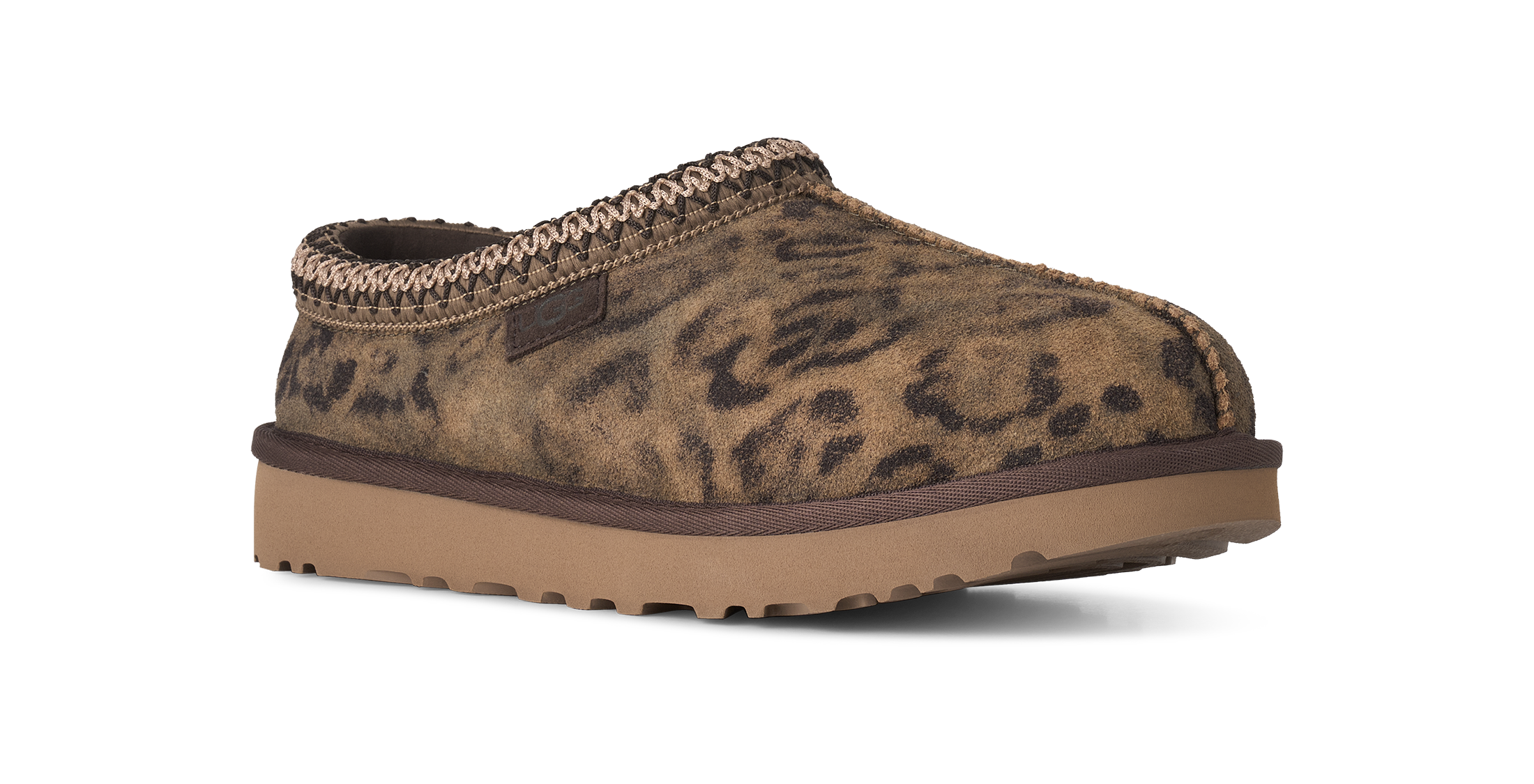 Brown leopard print slipper with a brown sole on a white background