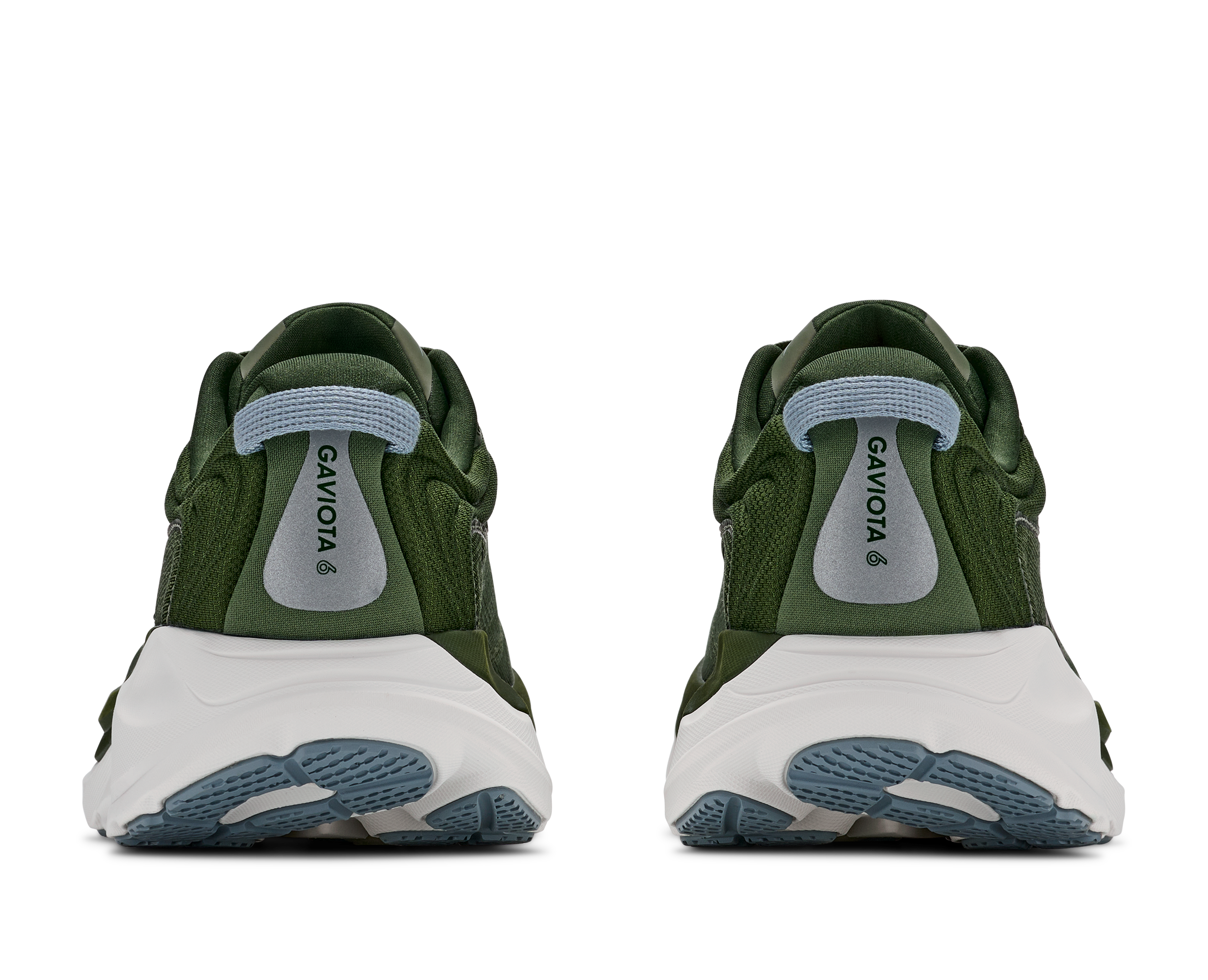 Green sneakers with white soles on a white background