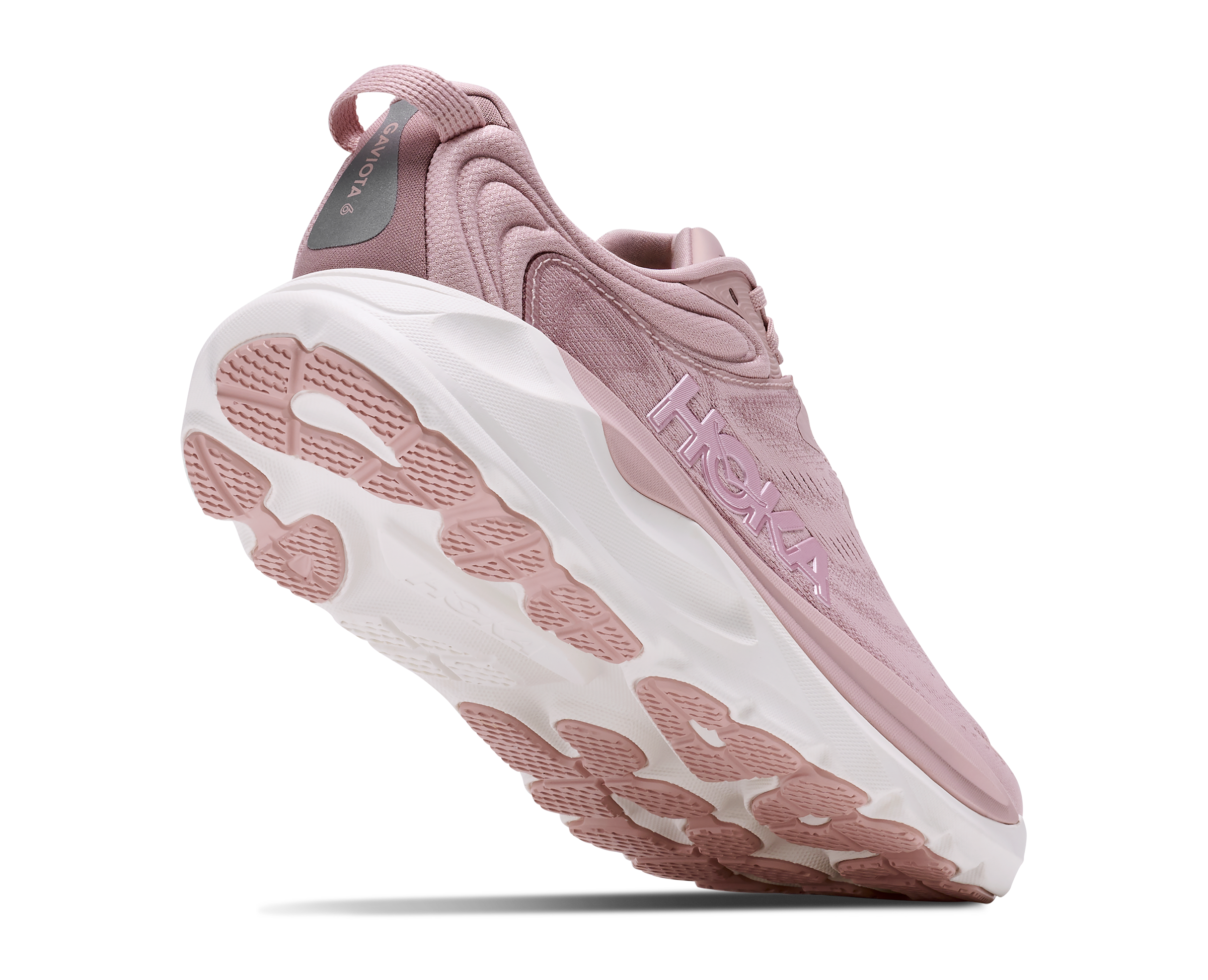 A single Hoka running shoe in dusty pink and white, shown from a three-quarters angle against a plain white background.