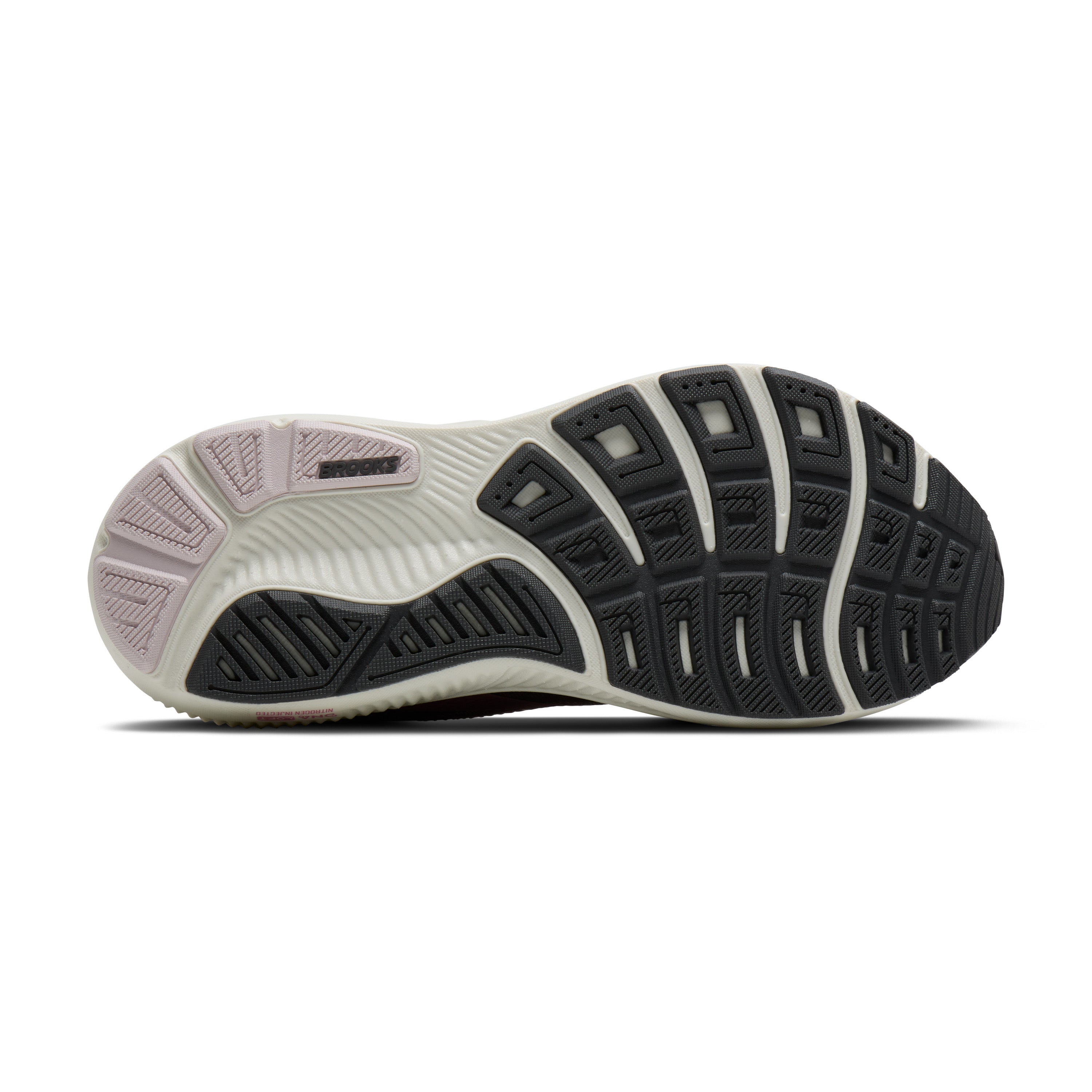 Close-up of a running shoe sole with tread pattern on a white background