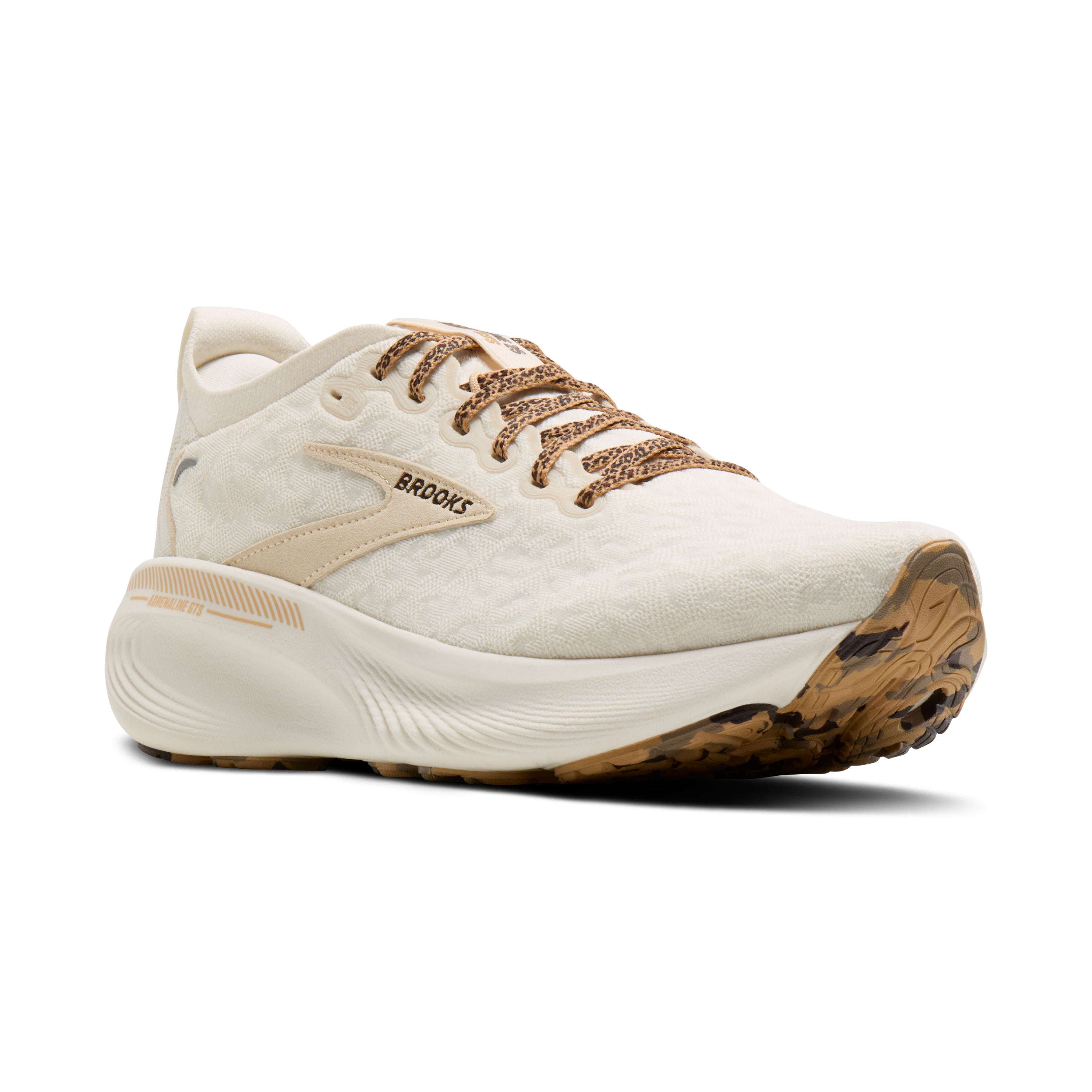 White running shoe with brown sole on a white background