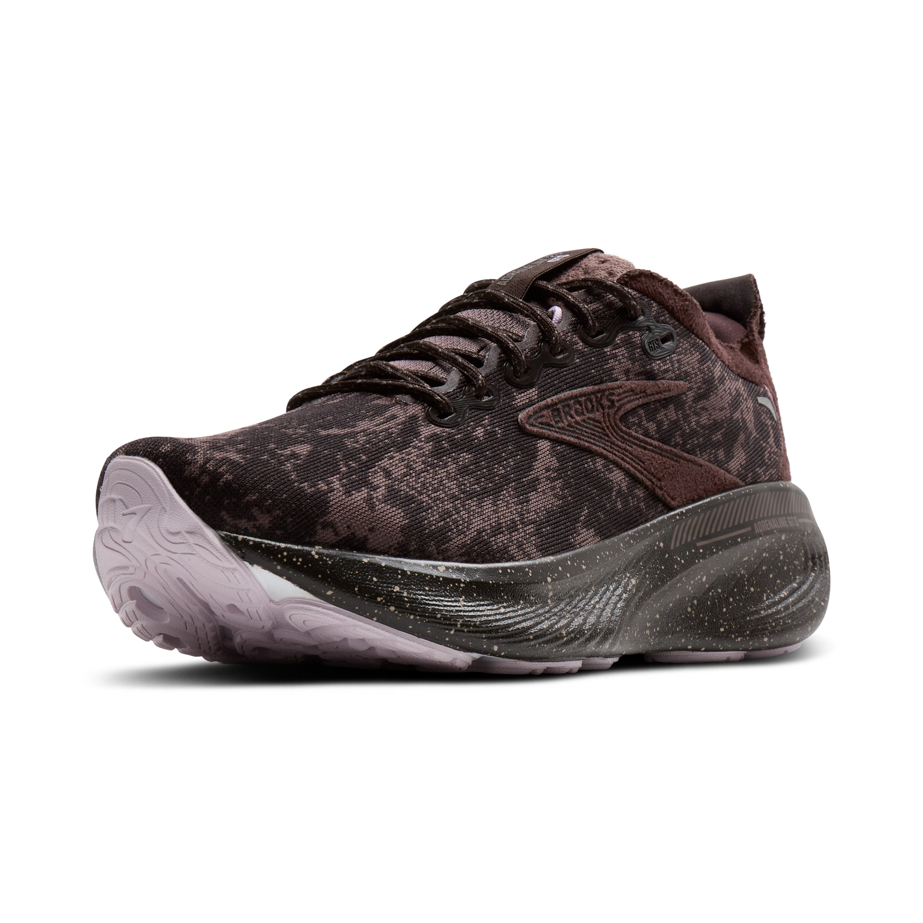 Brown athletic shoe with black sole on a white background