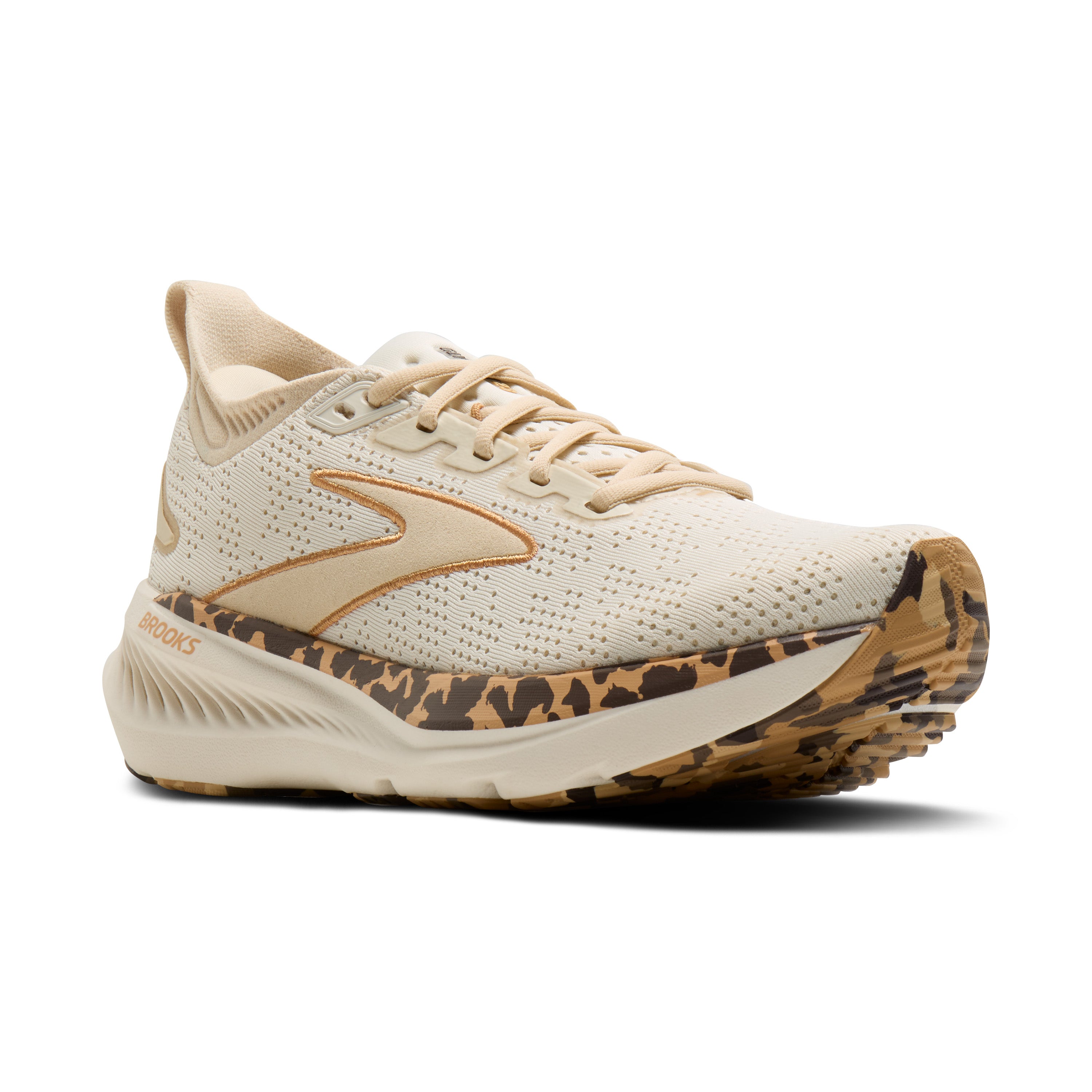 Beige running shoe with leopard print sole on a white background