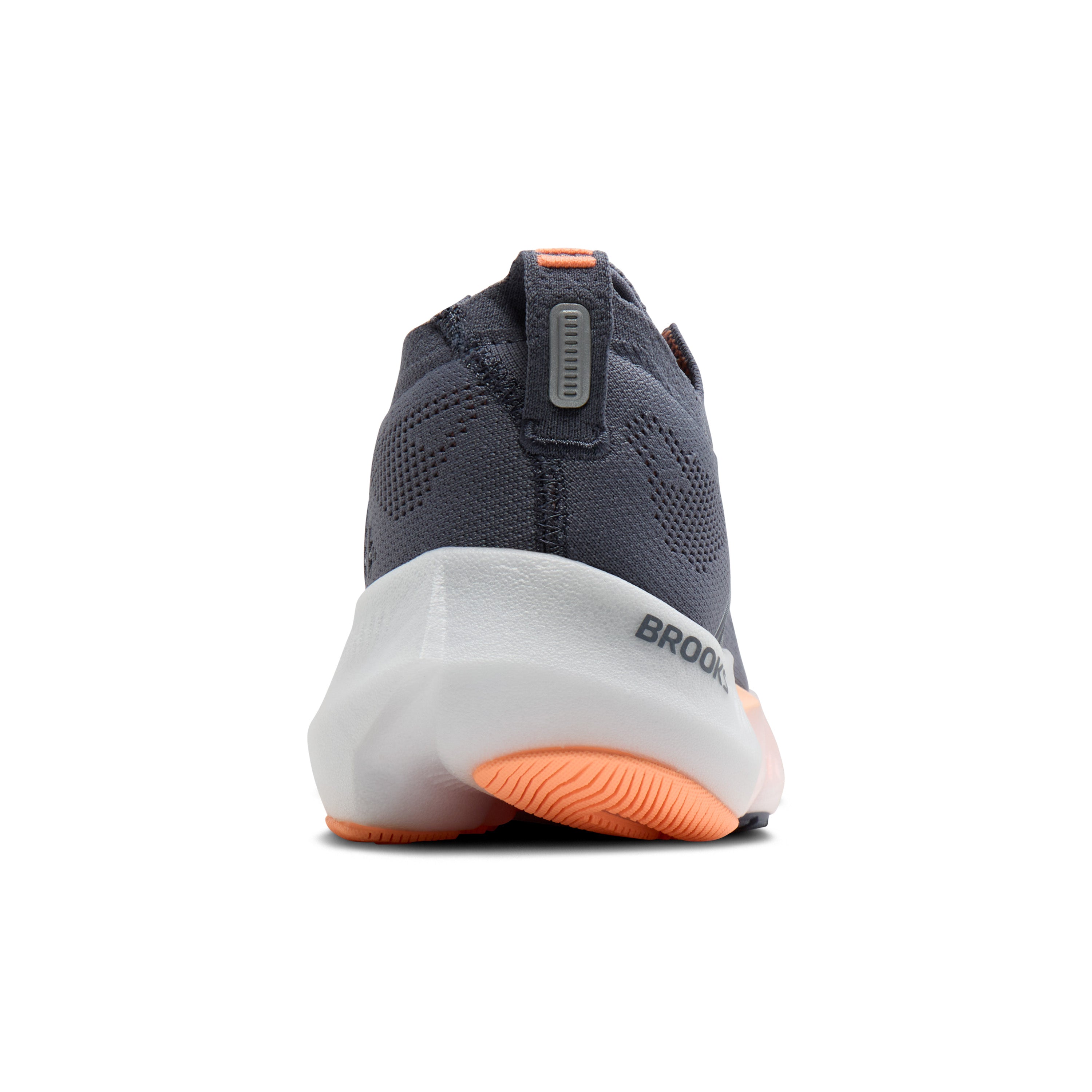 Gray running shoe with orange sole on a white background
