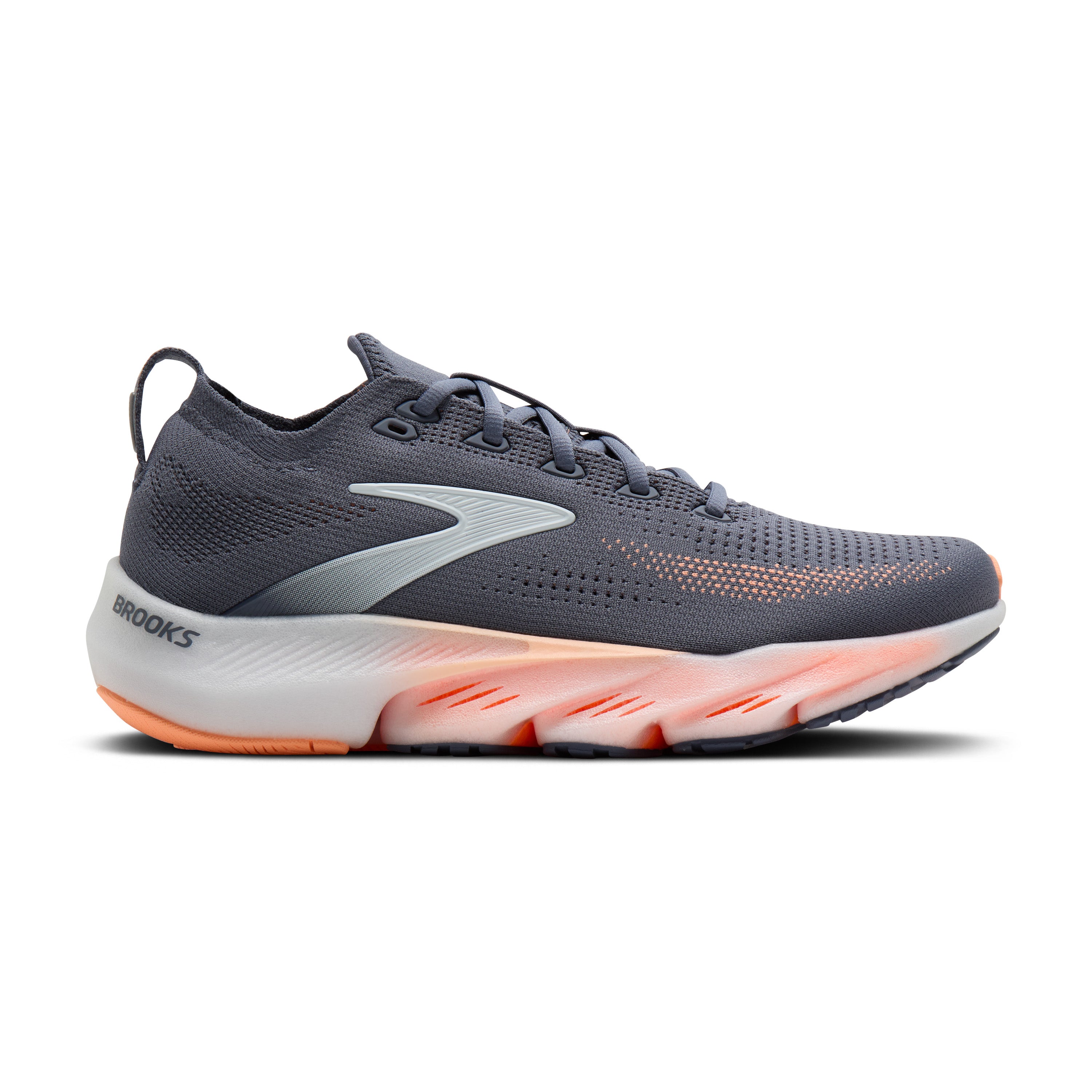 Gray running shoe with orange sole on a white background