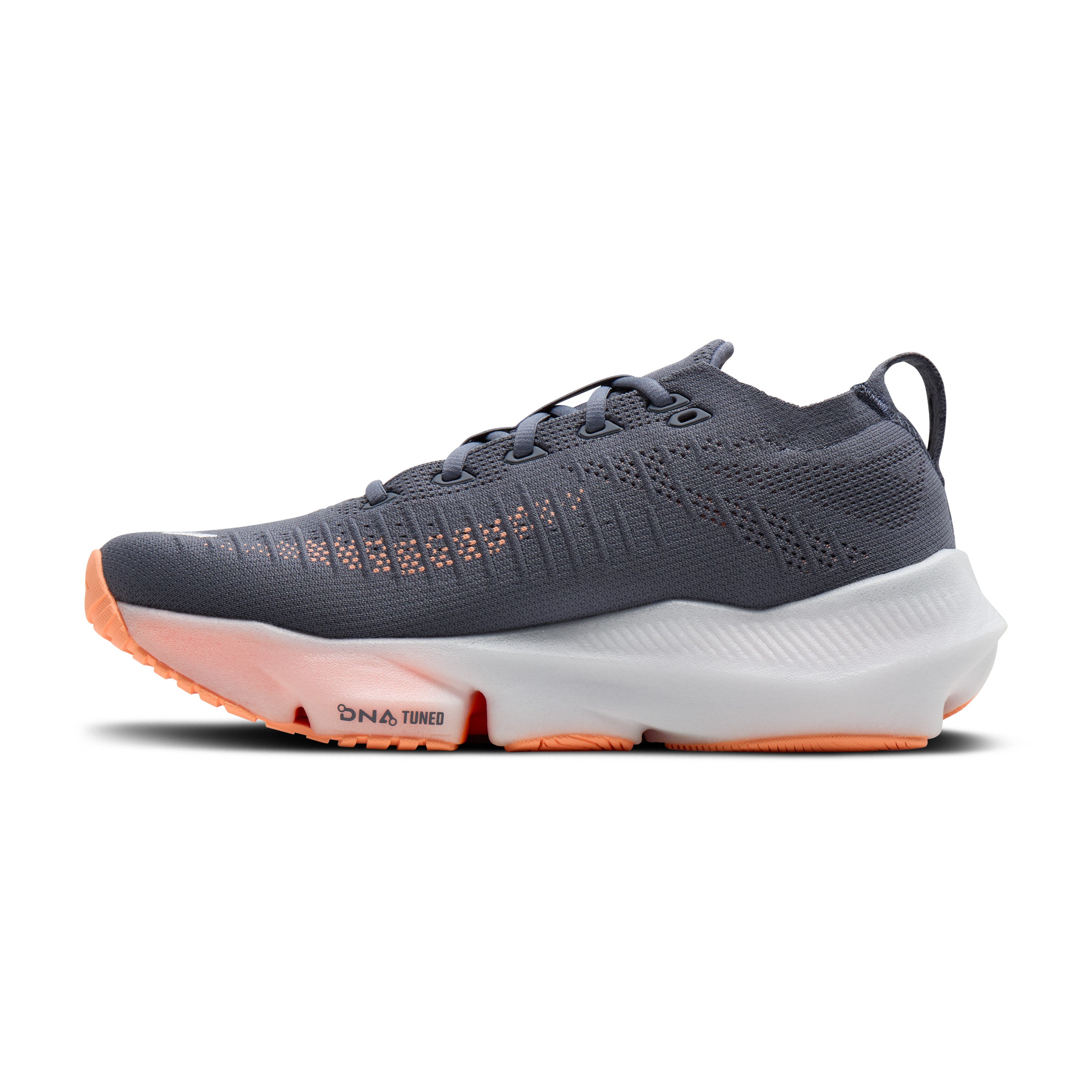 Gray running shoe with orange sole on a white background