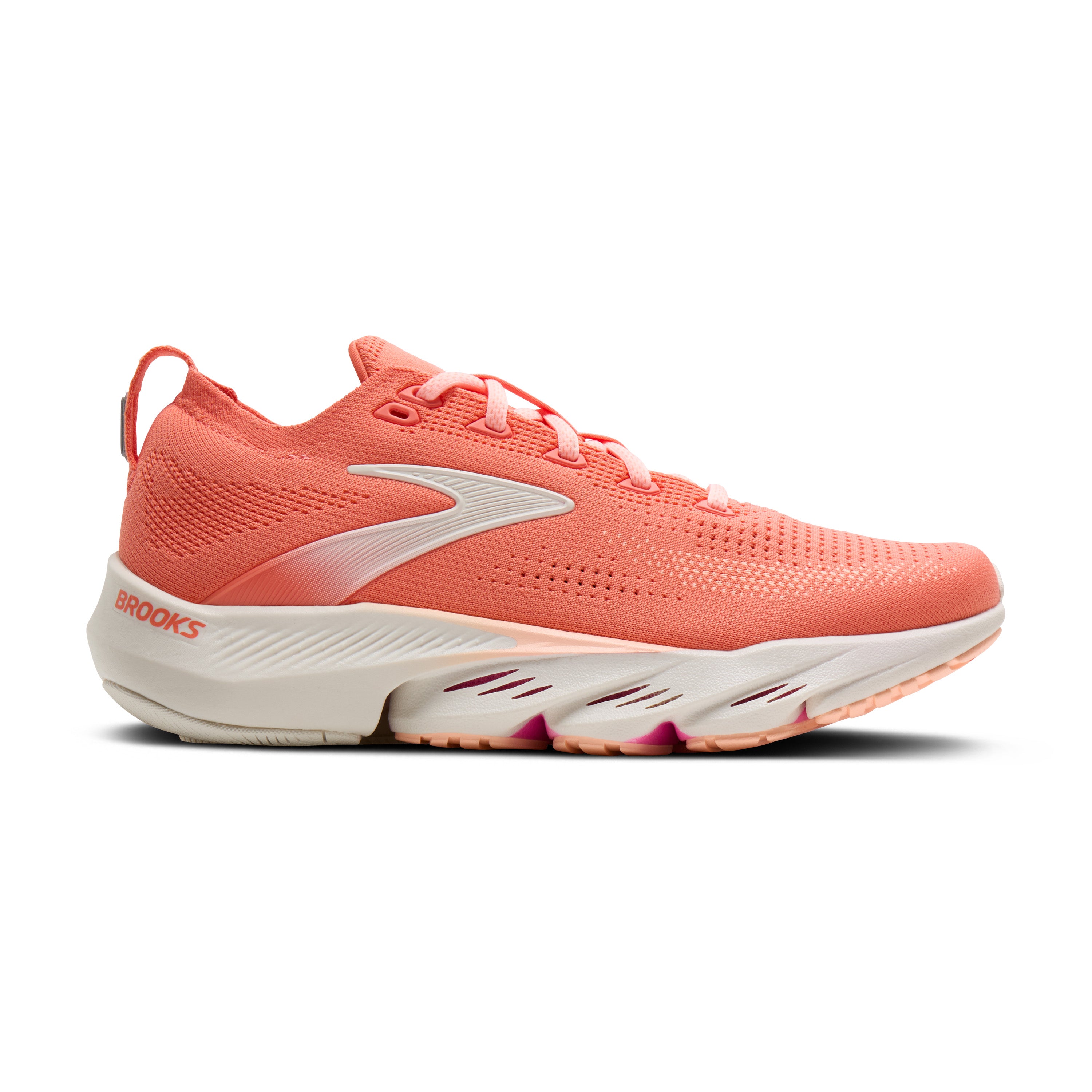 Coral running shoe with white sole on a white background